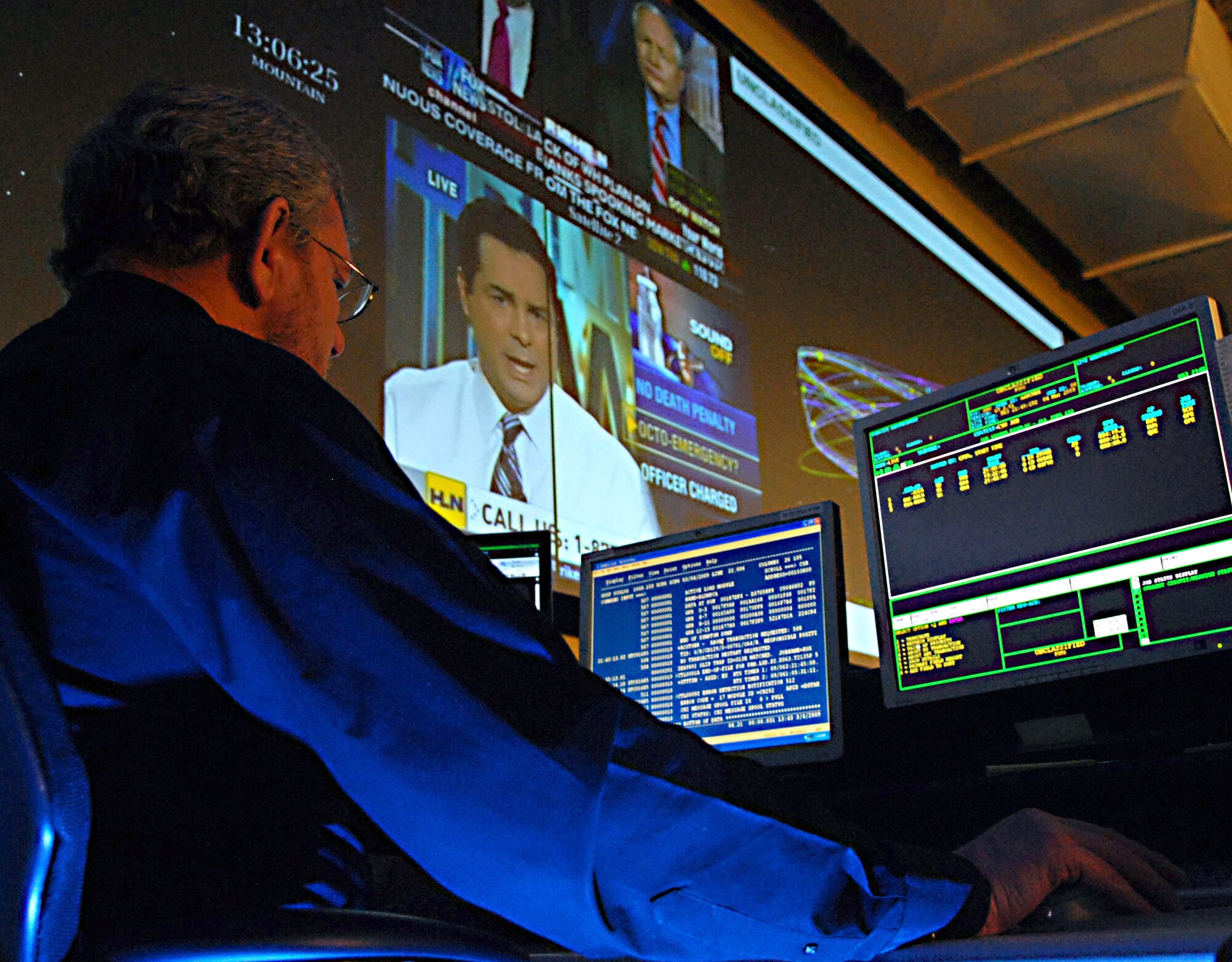 Paul McMeekin, a system program analyst at the Joint Space Operations Center at Vandenberg Air Force Base, Calif., reviews data received on the Delta II site there.  The purpose of the JSpOC is to provide a focal point for the operational employment of worldwide joint space forces, and enable the commander of Joint Functional Component Command Space to integrate space power into global military operations.  (U.S. Air Force photo/Airman 1st Class Antoinette Lyons) 