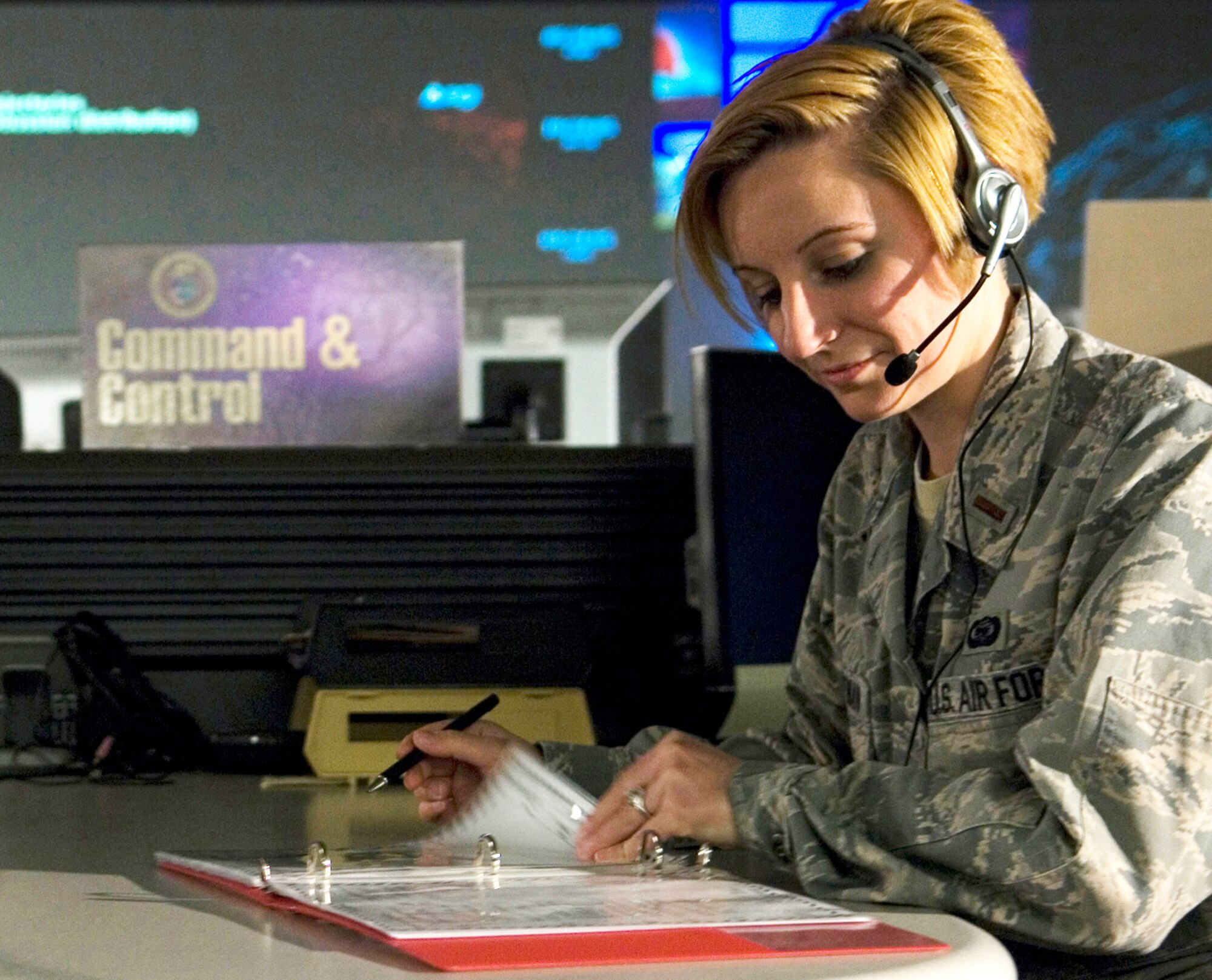 Second Lt. Melissa Huffman, a collections analyst at the Joint Space Operations Center at Vandenberg Air Force Base, Calif., reviews data received on the Delta II site there.  The purpose of the JSpOC is to provide a focal point for the operational employment of worldwide joint space forces, and enable the commander of Joint Functional Component Command Space to integrate space power into global military operations. (U.S. Air Force photo/Airman 1st Class Andrew Lee) 