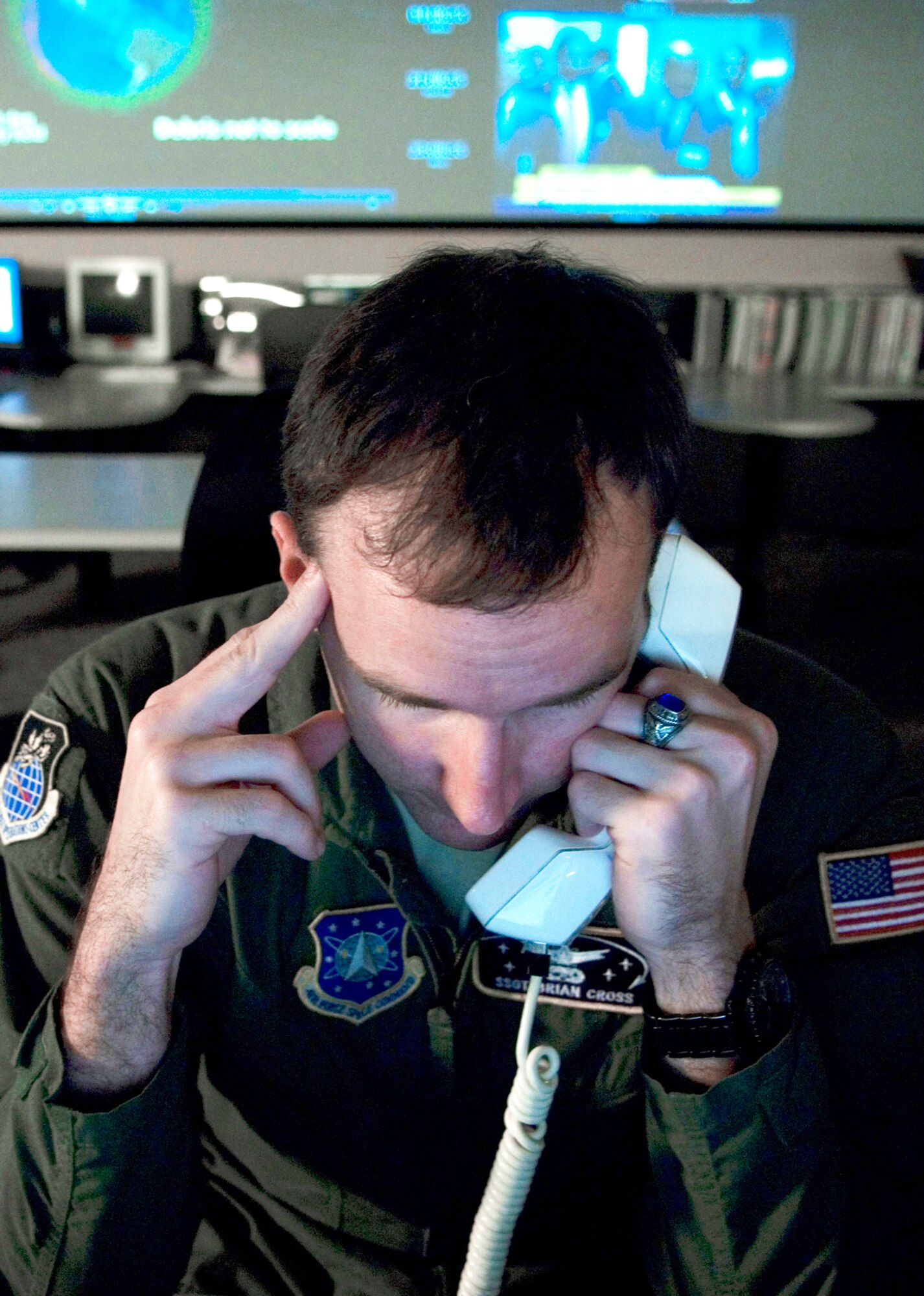 Staff Sgt. Brian Cross, a missile warning censor controller at the Joint Space Operations Center at Vandenberg Air Force Base, Calif., receives a phone call with information regarding the Delta II site there. The purpose of the JSpOC is to provide a focal point for the operational employment of worldwide joint space forces, and enable the commander of Joint Functional Component Command Space to integrate space power into global military operations. (U.S. Air Force photo/Airman 1st Class Andrew Lee) 