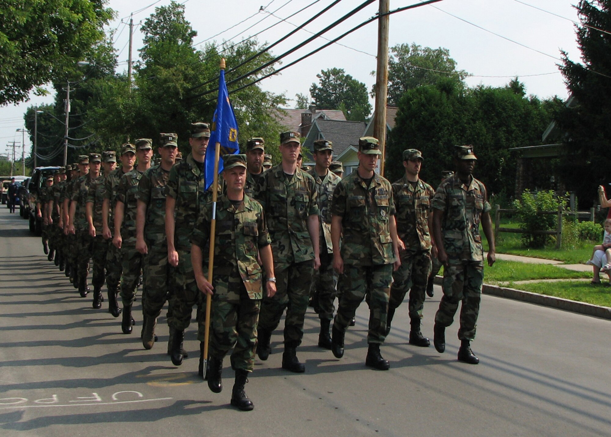 Members from the Northeast Air Defense Sector march during the Honor America Days Parade in Rome, N.Y. July 26. The 1.5 mile parade in Rome included a bi-national color guard and participants from NEADS, Air Force Research Laboratory, Information Directorate, and the Rome Free Academy Junior ROTC. Additionally, 2 CF-18s from the 425 Tactical Fighter Squadron, located in Bagotville, Quebec, Canada performed a flyover July 27 in honor of the North American Aerospace Defense Command’s 50th Anniversary (Courtesy photo).