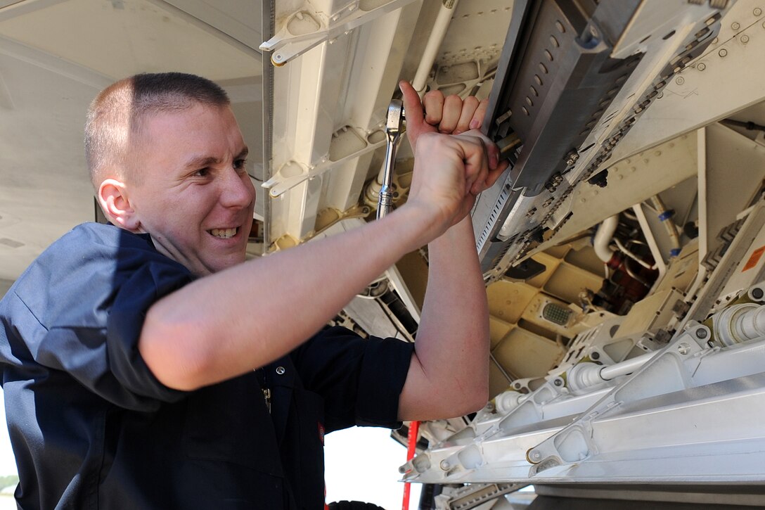 LANGLEY AIR FORCE BASE, Va. – Senior Airman Hagan Fee, 94th Aircraft Maintenance Unit weapons load crew member, prepares F-22A Raptor's weapons bay during a quarterly weapons load crew competition here April 17. Squadron Airmen are judged quarterly on their accuracy, efficiency and speed. (U.S. Air Force photo/Airman 1st Class Gul Crockett)