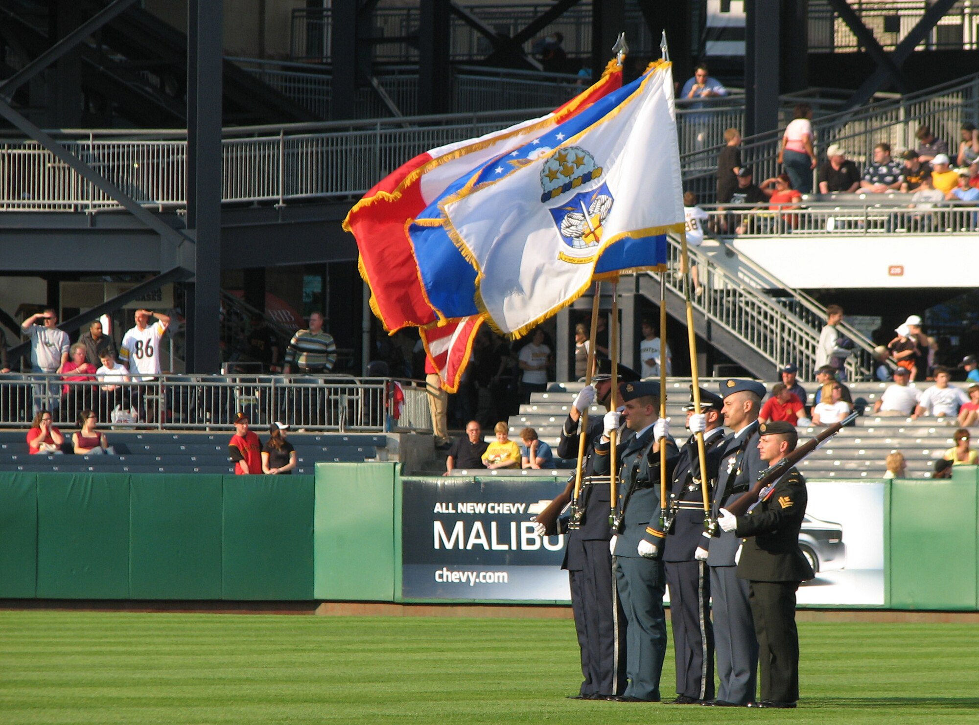 ROME, N.Y. -- Members from the Northeast Air Defense Sector from Rome, N.Y.,
stand at attention at the center of the Pittsburgh Pirates stadium for the singing of the Canadian and U.S. National Anthem. The NEADS bi-national color guard presented arms at the first-ever Toronto Blue Jays vs. the Pirates baseball game June 20. Additionally, Stephen Brereton, Consul General for Canada in Buffalo, threw out the first pitch of the game (Photo by Master Sgt. Danny Doucette).