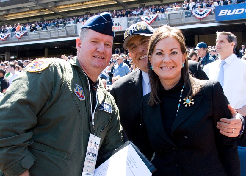 New York Air National Guard Maj. James T. Belton poses with former New York City Mayor Rudy Giuliani and wife Judith Giuliani at the “New” Yankee Stadium in Bronx, NY on 16 April 2009. Belton was assisting in the Four F-16C Fighting Falcons from the 174th Fighter Wing, Syracuse New York Air National Guard with the fly-by. (US Air Force photo by Tech. Sgt. Jeremy M. Call/Released)
