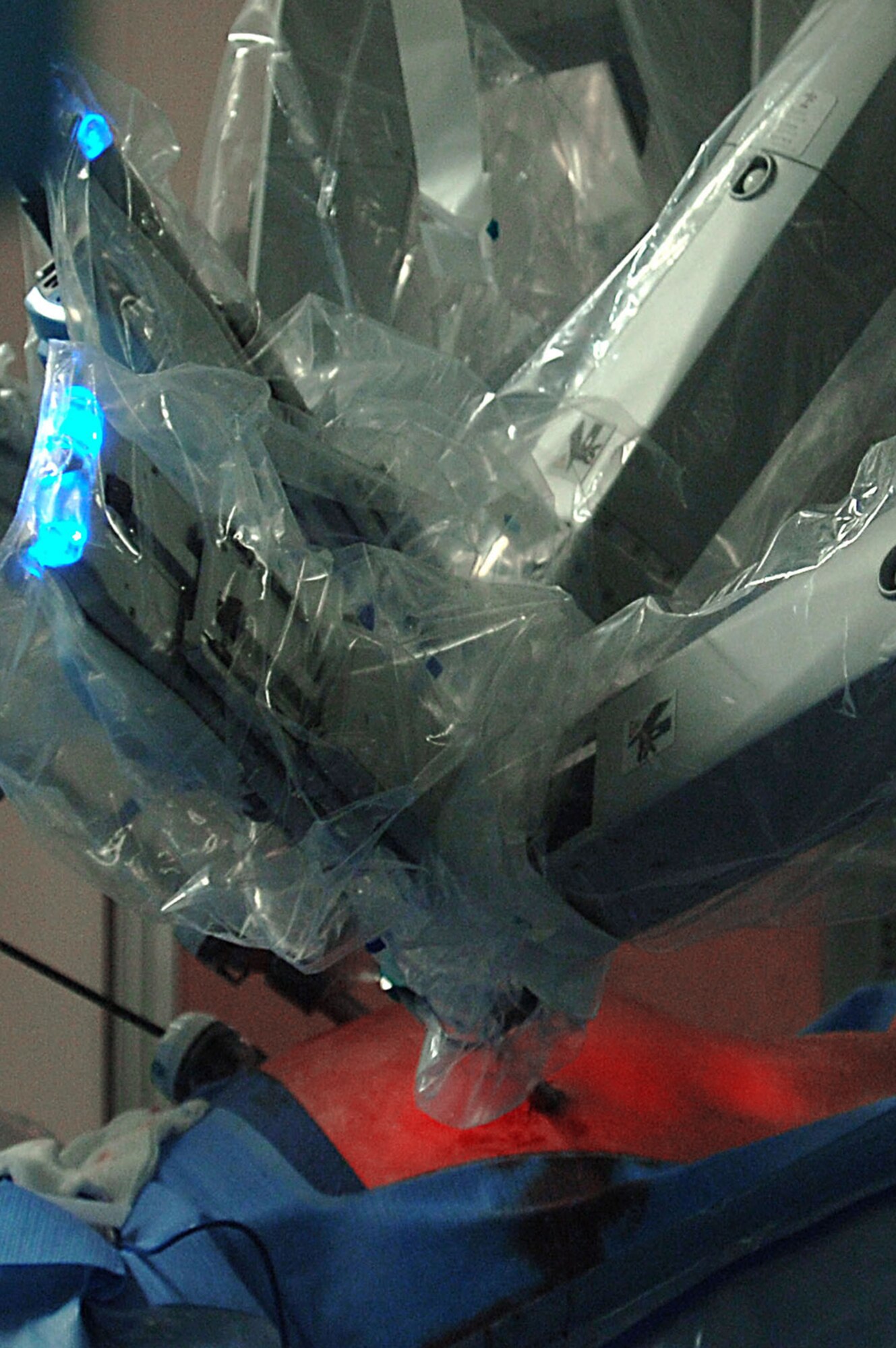 A robot assists in a laparoscopic prostatectomy, or the surgical removal of prostate cancer, April 10 at Wilford Hall, Lackland Air Force Base, Texas. The robot converts the surgeon's hand movements into very precise movements of tiny instruments inside the patient. This was the first robot-assisted surgery in the Air Force, performed by Lt. Col. (Dr.) Kyle Weld, director of endourolog at the 59th Surgical Specialties Squadron. (U.S. Air Force photo/Senior Airman Josie Kemp) 