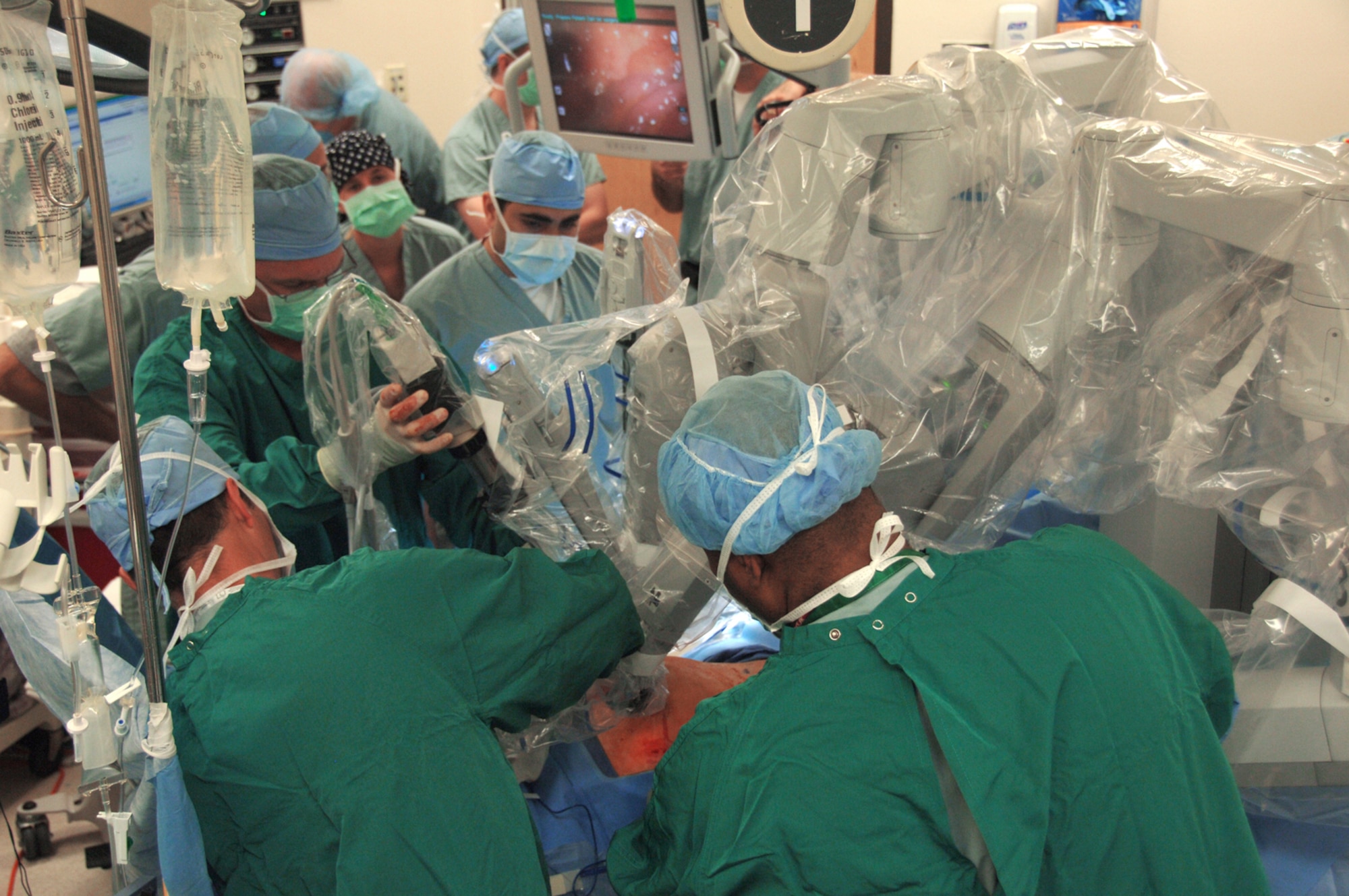 A robot is placed by doctors for a laparoscopic prostatectomy, or the surgical removal of prostate cancer, April 10 at Wilford Hall Medical Center, Lackland Air Force Base, Texas. This was the first robot-assisted surgery in the Air Force and was performed by Lt. Col. (Dr.) Kyle Weld, director of endourology at the 59th Surgical Specialties Squadron. (Air Force photo/Senior Airman Nicole Roberts) 