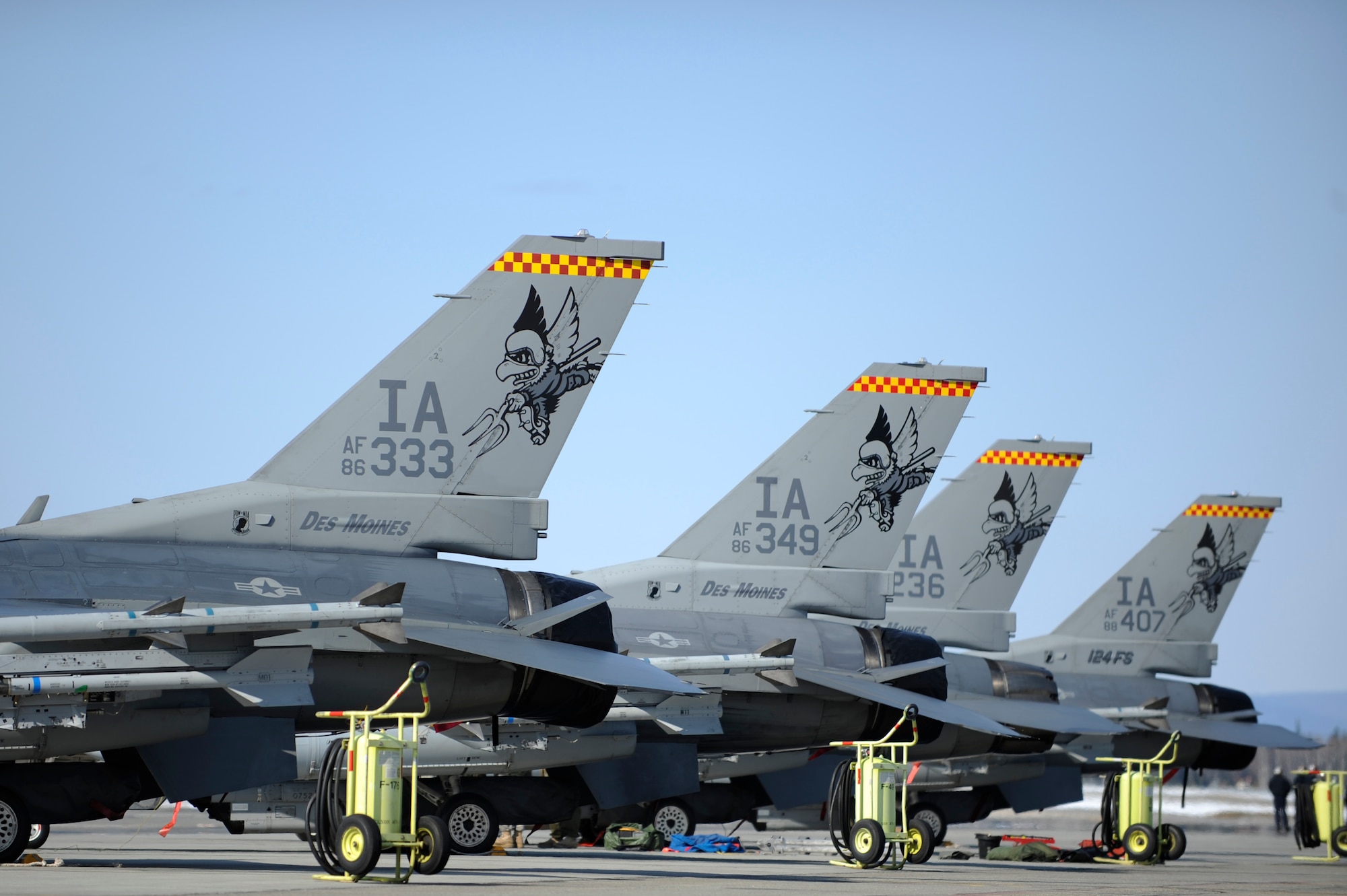 Four F-16 Fighting Falcons, 124th Fighter Squadron from De Moines, Iowa  sit on the tarmac in preparation for RED FLAG-Alaska 09-2, April 16, 2009, Eielson Air Force Base Alaska. RF-A is a Pacific Air Forces-directed field training exercise for U.S. and coalition forces flown under simulated air-combat conditions. It is conducted on the Pacific Alaska Range Complex with air operations flown out of Eielson and Elmendorf Air Force Bases.  (U.S. Air Force photo/Senior Airman Jonathan Snyder)