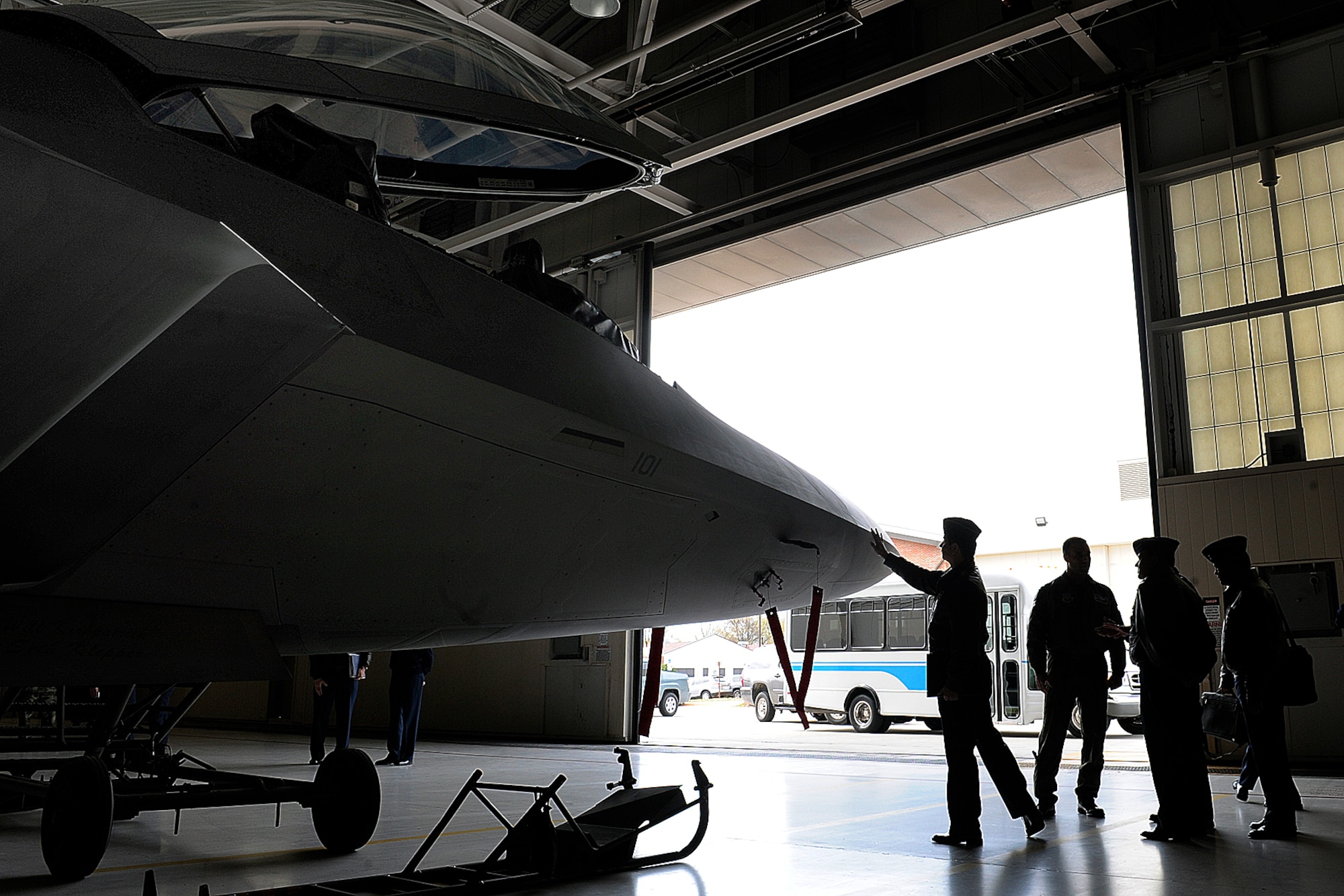 LANGLEY AIR FORCE BASE, Va. --  Gen. Jorge Ballasteros Rodriquez, Colombian air force commander, examines a F-22A Raptor during a briefing by Lt. Col. Adrian Spain, 94th Fighter Squadron commander, here April 13.  General Rodriquez received a tour of the day-to-day Air Force mission.  (U.S. Air Force photo/Senior Airman Vernon Young)