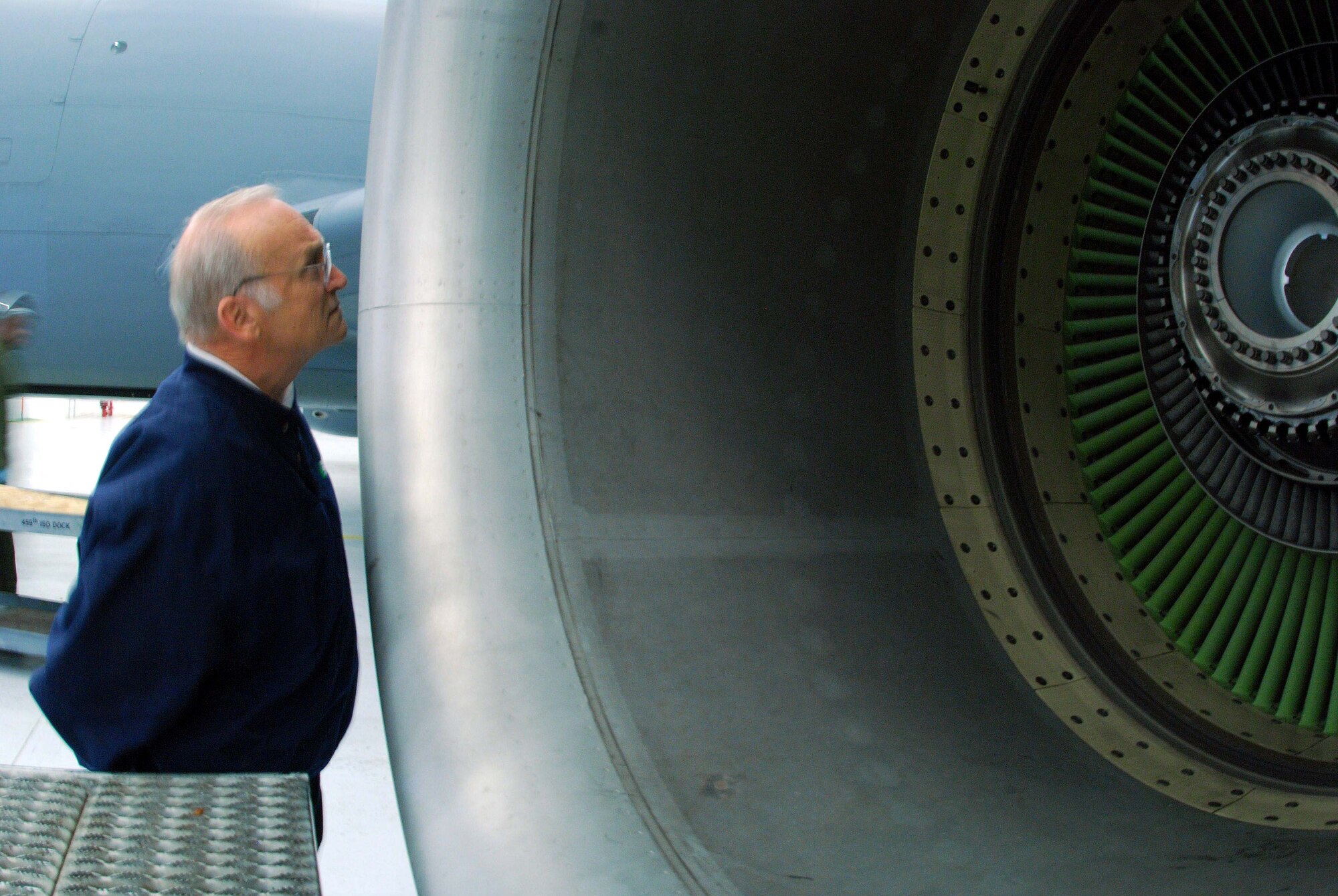 Lee Schiek, 459th Air Refueling Wing honorary commander peers inside a KC-135R engine during a visit to the 459 ARW April 3. (U.S. Air Force photo/ Senior Airman Ashley Crawford)