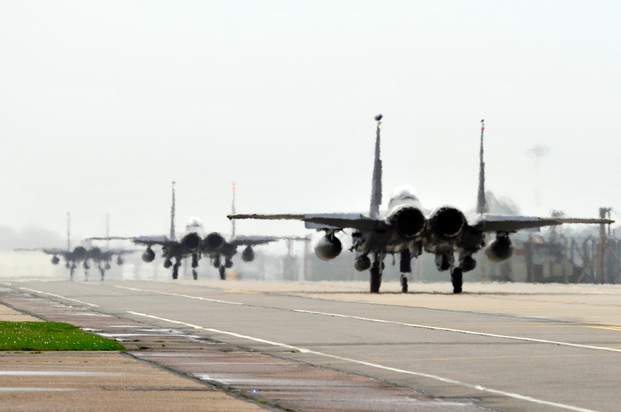 ROYAL AIR FORCE LAKENHEATH, England -- Three F-15E Strike Eagles taxi to the runway here April 17, 2009. The 494th Fighter Squadron departed Friday morning to participate in the Strike Lance 2009 exercise at Campia Turzii, Romania. (U.S. Air Force photo by Airman 1st Class Perry Aston) (Released)