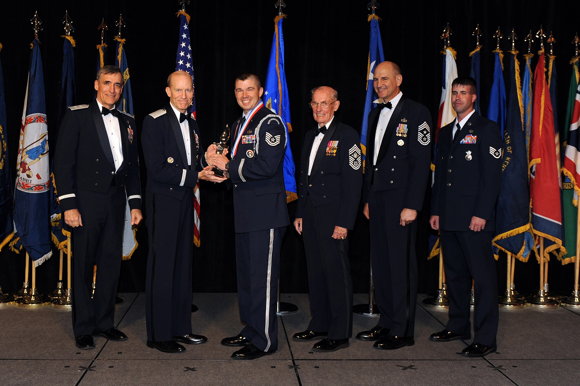 OFFUTT AIR FORCE BASE, Neb. - Tech. Sgt. Theron Lord, Jr, Davis-Monthan AFB, Ariz., accepts the award for Outstanding Honor Guard Program Manager of the Year from Gen. John D.W. Corley, Air Combat Command commander, during the 2009 ACC Outstanding Airmen of the Year Recognition Gala at the Omaha Hilton April 15.

U.S. Air Force Photo by Josh Plueger