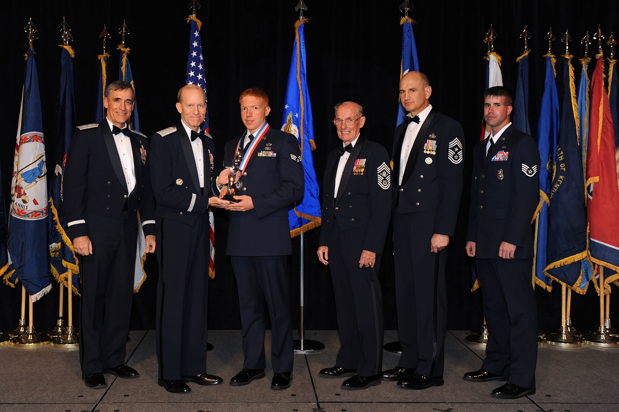 OFFUTT AIR FORCE BASE, Neb. - Senior Airman Alexander Royal, Fort Carson Army Installation, Colo., accepts the award for Outstanding Airman of the Year from Gen. John D.W. Corley, Air Combat Command commander, during the 2009 ACC Outstanding Airmen of the Year Recognition Gala at the Omaha Hilton April 15.

U.S. Air Force Photo by Josh Plueger