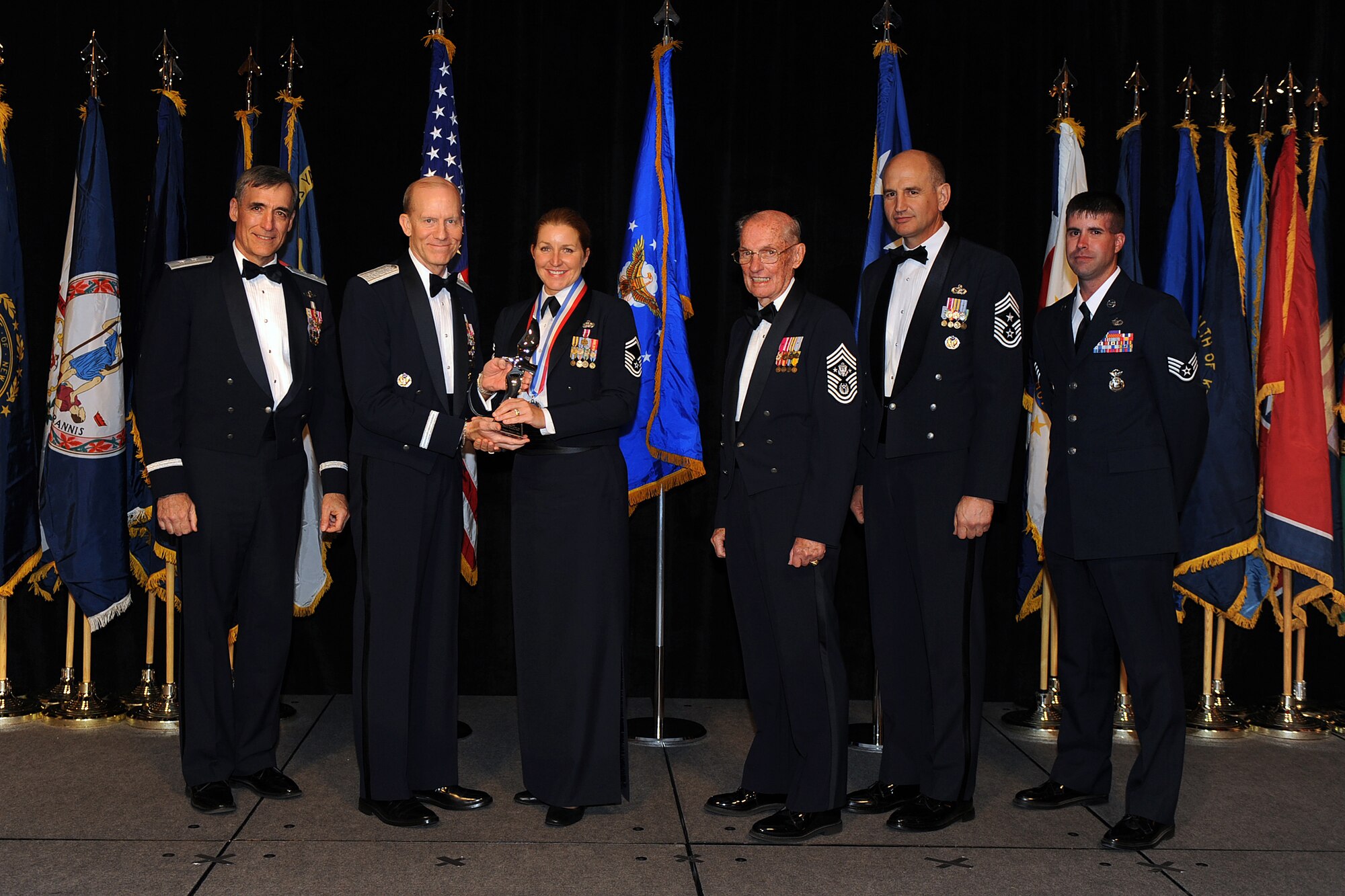 OFFUTT AIR FORCE BASE, Neb. - Senior Master Sgt. Tamara Olson, Langley AFB, Va., accepts the award for Outstanding Senior NCO of the Year from Gen. John D.W. Corley, Air Combat Command commander, during the 2009 ACC Outstanding Airmen of the Year Recognition Gala at the Omaha Hilton April 15.

U.S. Air Force Photo by Josh Plueger