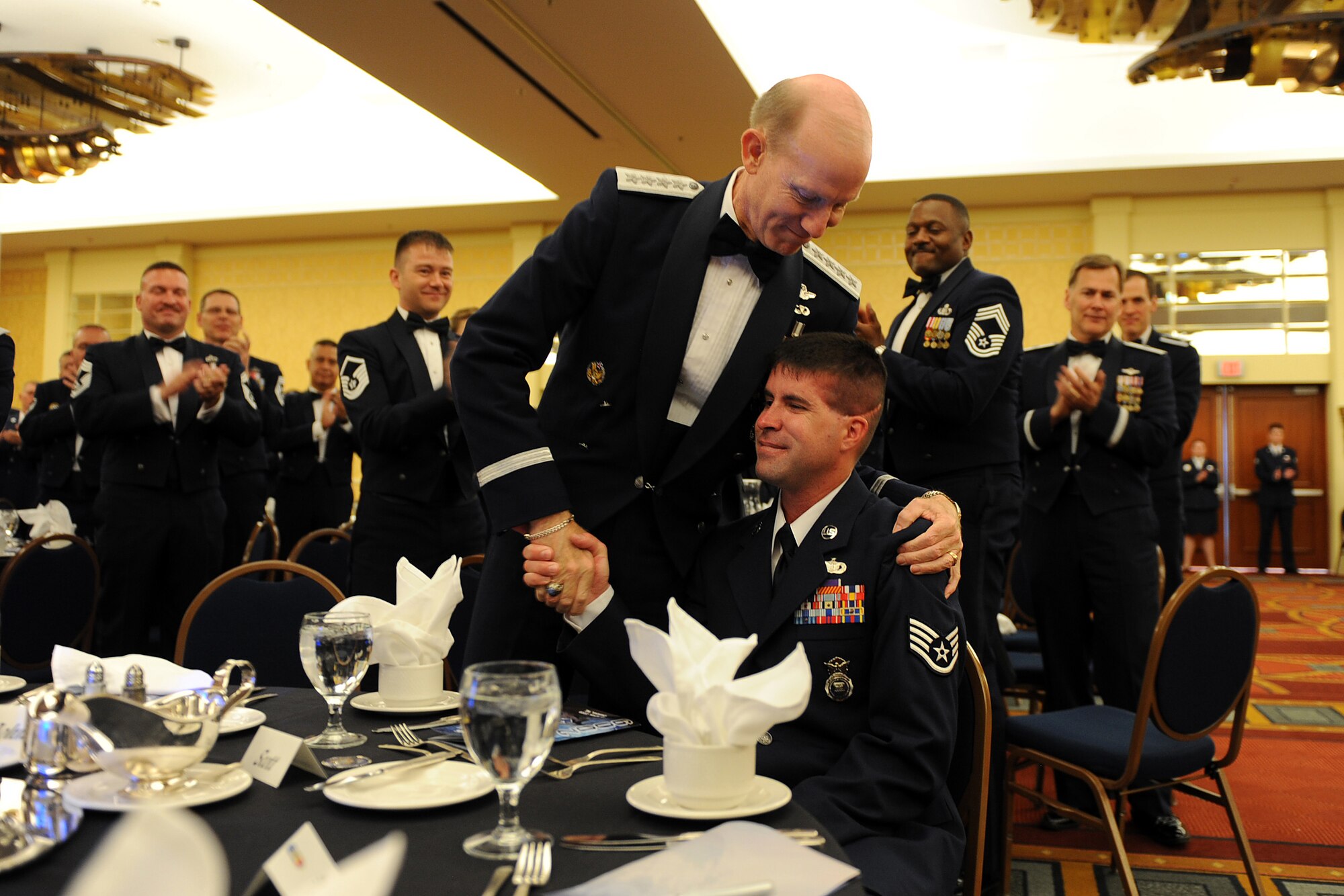 OFFUTT AIR FORCE BASE, Neb. - General John D.W. Corley, commander Air Combat Command, shows both his admiration and appreciation to Staff Sgt. Scott Lilley, during the 2009 ACC Outstanding Airmen of the Year Recognition Gala at the Omaha Hilton April 15. Sergeant Lilley was deployed from Minot AFB, N.D. on April 15, 2005 when his vehicle was attacked in Iraq. Sustaining severe injuries, Sergeant Lilley was not expected to live. Two years to the date from the attack he was the personal guest of Gen. Corley at the 2009 Gala and an inspiration to the general and all military members in attendance. 

U.S. Air Force Photo by Josh Plueger
