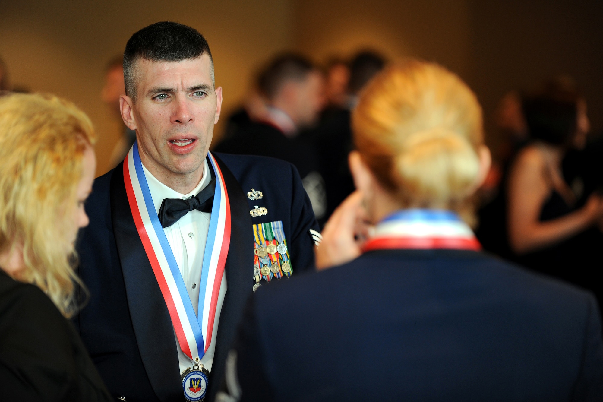 OFFUTT AIR FORCE BASE, Neb. - Tech. Sgt. Ricky Willis, Seymour-Johnson AFB, N.C., socializes with fellow nominees after the medallion ceremony and prior to the 2009 Air Combat Command Outstanding Airmen of the Year Recognition Gala at the Omaha Hilton April 15.

U.S. Air Force Photo by Josh Plueger

