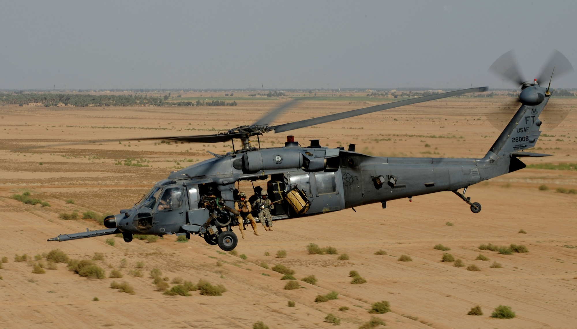 A U.S. Air Force HH-60 Pavehawk from the 64th Expeditionary Rescue Squadron, Joint Base Balad, Iraq, flies over the Iraqi landscape April 10, 2009, in support of Operation Iraqi Freedom.  (U.S. Air Force photo by Staff Sgt. James L. Harper Jr.)