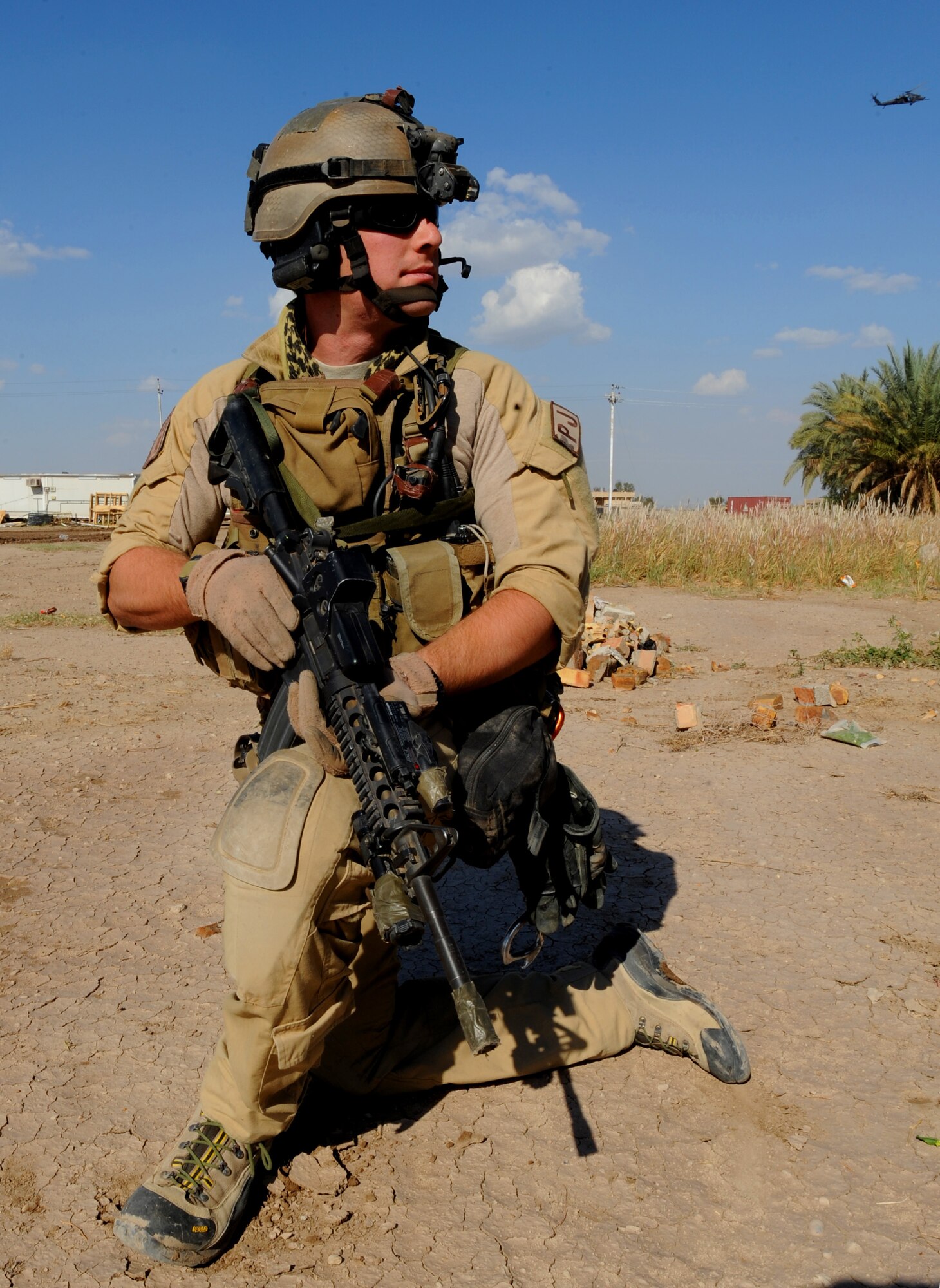 U.S. Air Force Pararescueman Senior Airman Matthew, from the 64th Expeditionary Rescue Squadron, Joint Base Balad, Iraq, conducts security for an HH-60 Pavehawk helicopter during proficiency training outside of Baghdad, Iraq, April 10, 2009, in support of Operation Iraqi Freedom.  (U.S. Air Force photo by Staff Sgt. James L. Harper Jr.)