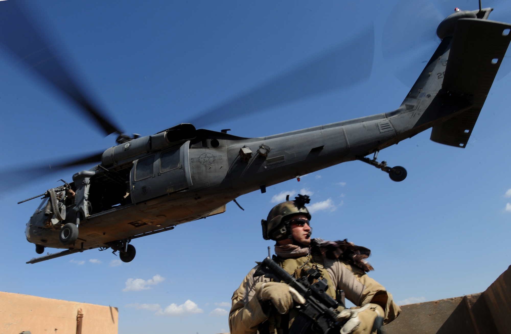U.S. Air Force Pararescueman Staff Sgt. Ivan Eggel, 64th Expeditionary Rescue Squadron, Joint Base Balad, Iraq, conducts security for an HH-60 Pavehawk helicopter during a proficiency exercise April 10, 2009, in support of Operation Iraqi Freedom.  (U.S. Air Force photo by Staff Sgt. James L. Harper Jr.)