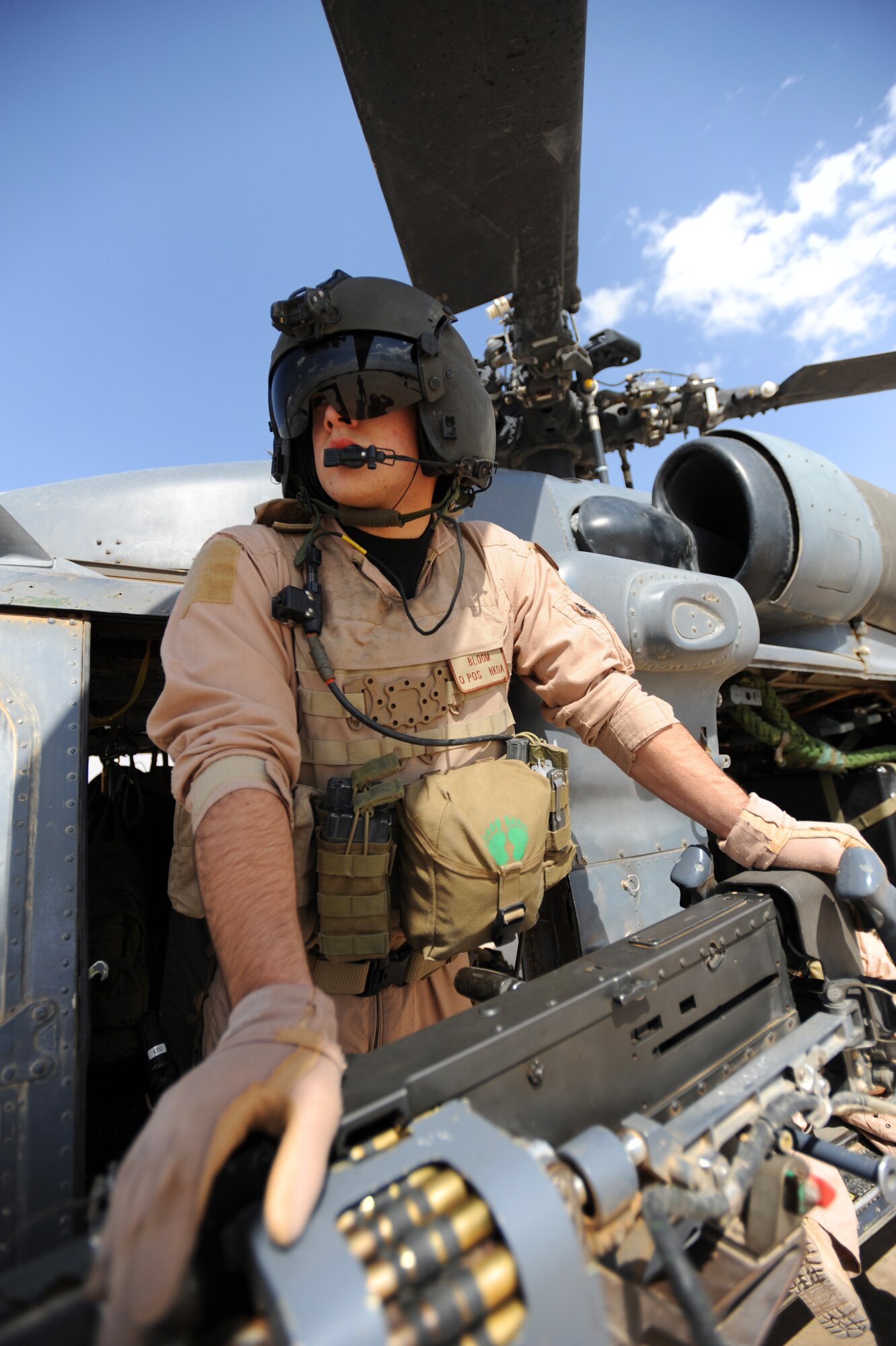 U.S. Air Force HH-60 Pavehawk helicopter gunner Staff Sgt. Derrick Bloom, 64th Expeditionary Rescue Squadron, Joint Base Balad, Iraq, stands by for engine startup prior to a proficiency exercise outside of Baghdad, Iraq, April 10, 2009, in support of Operation Iraqi Freedom.  (U.S. Air Force photo by Staff Sgt. James L. Harper Jr.)