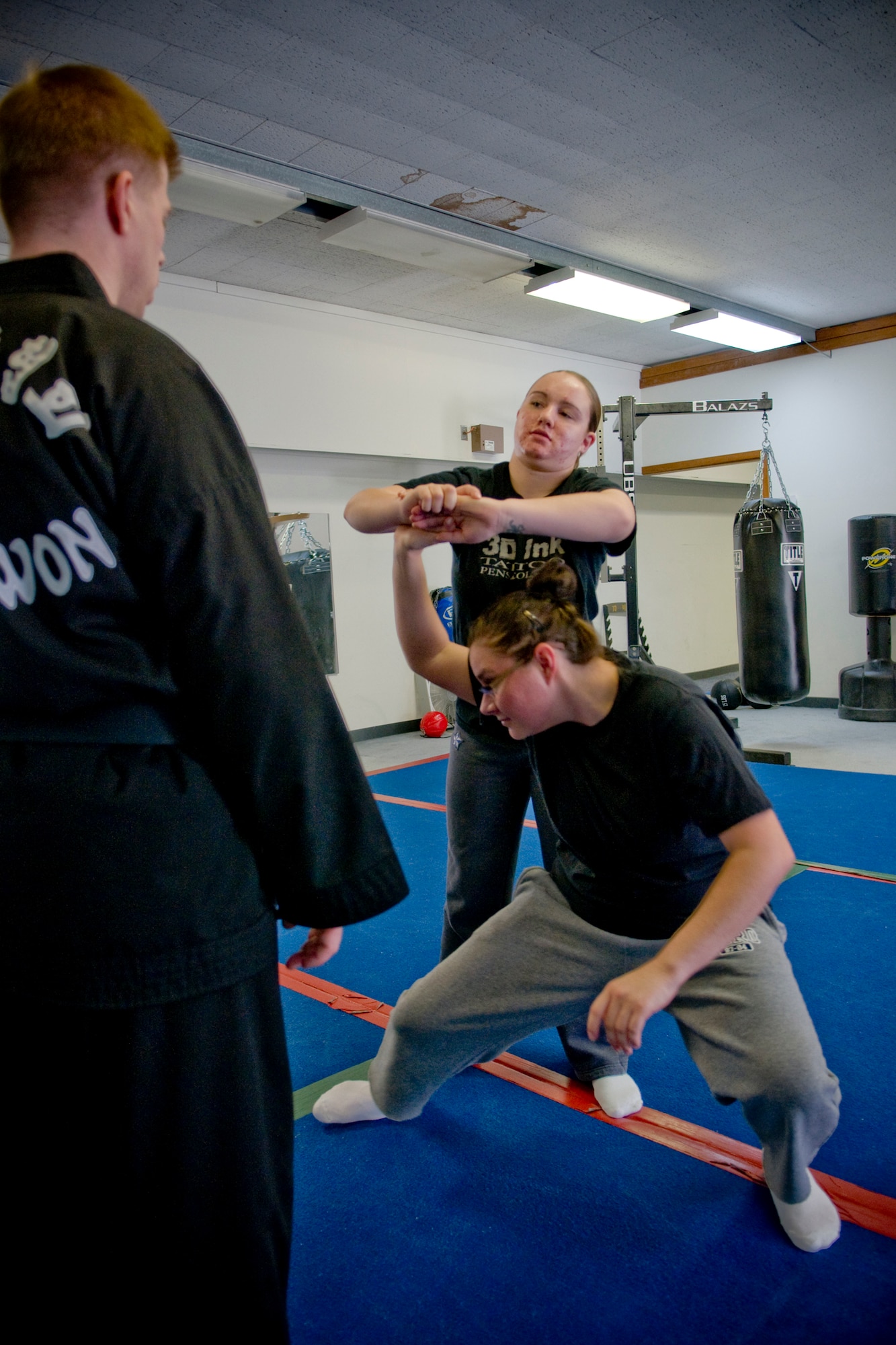 MISAWA AIR BASE, Japan -- Staff Sgt. Tatum Ramos escapes capture from Airman 1st Class Nicole Mangione during a women's self-defense class April 16, 2009. The class helped women develop more confidence and taught them how to be aware of their surroundings and escape from potential danger. (U.S. Air Force photo by Senior Airman Jamal D. Sutter)