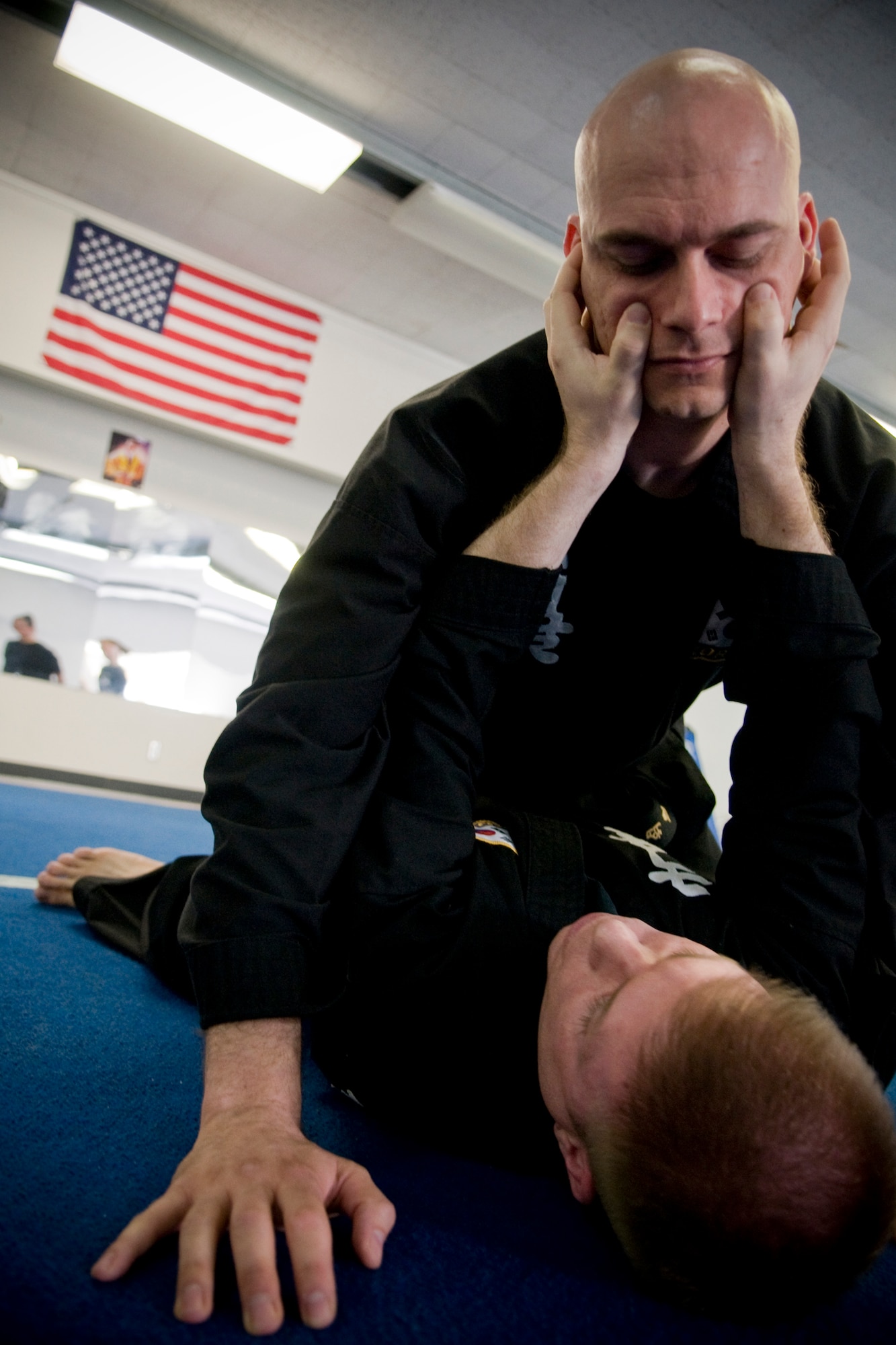 MISAWA AIR BASE, Japan -- Instructors 1st Lt. Brian Myers and Master Sgt. Jeremy Fuegi demonstrate how to use pressure points to escape an attack during a women's self-defense class April 16, 2009. The two, who regularly hold classes for the Korean martial art Kuk Sool Won, volunteered to spread their knowledge in support of Sexual Assault Awareness Month. (U.S. Air Force photo by Senior Airman Jamal D. Sutter)