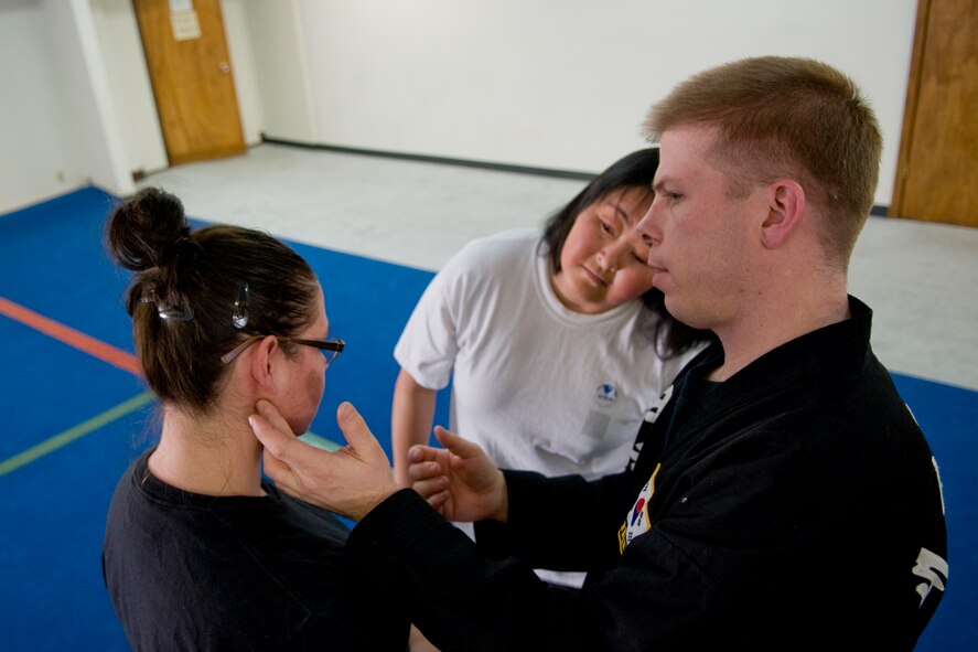 MISAWA AIR BASE, Japan -- 1st Lt. Brian Myers, Kuk Sool Won instructor, shows the location of a pressure point during a women's self-defense class April 16, 2009. The class taught women basic techniques needed to avoid danger if ever attacked. (U.S. Air Force photo by Senior Airman Jamal D. Sutter)