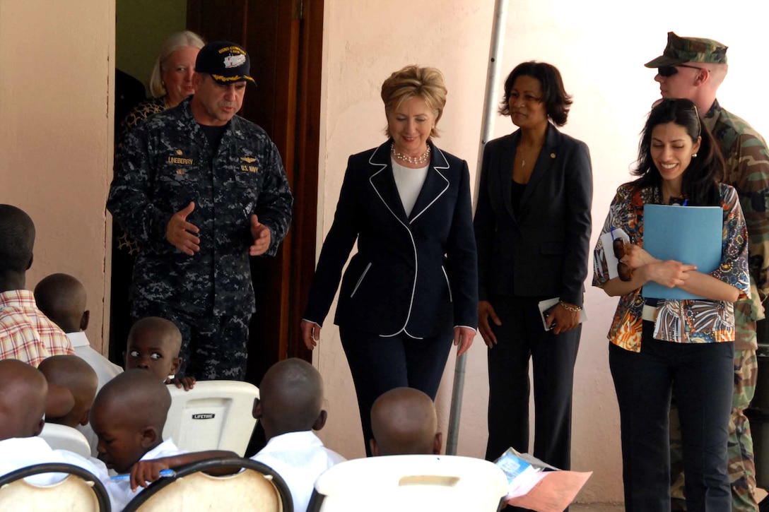U.S. Navy Capt. Robert G. Lineberry Jr., commodore of USNS Comfort and tactical commander of Continuing Promise 2009, gives Secretary of State Hillary Rodham Clinton a tour through a medical site in the Cite Soleil section of Port au Prince, where his crew is providing medical and dental care to Haiti’s poorest residents. U.S. Navy photo by Petty Officer 1st Class Brian Finney
