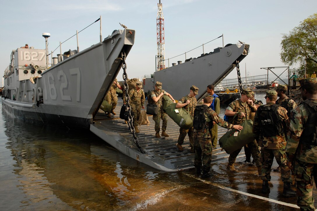 U.S. Marines disembark Landing Craft Utility 1627 in Subic Bay, Philippines, April 14, 2009. The Marines are assigned to the 31st Marine Expeditionary Unit, and are deployed aboard the amphibious assault ship USS Essex.