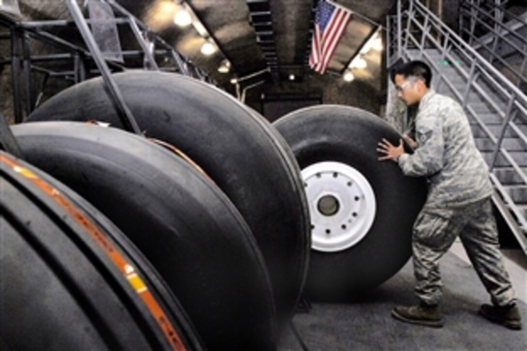 U.S. Air Force Staff Sgt. Ruben Ramones stores a C-130 Hercules wheel and tire after it passed the assembly inspection on an air base in Southwest Asia, april 13, 2009. The base wheel and tire shop supports eight forward operating locations and seven different types of aircraft with a full range of services. Ramones is the wheel and tire shift lead for the 379th Expeditionary Maintenance Squadron, and is deployed from Yokota Air Base, Japan.