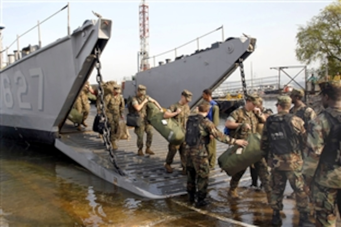 U.S. Marines disembark a landing craft utility in Subic Bay, Philippines, April 14, 2009. The Marines, deployed aboard the amphibious assault ship USS Essex, are participating in Balikatan 2009, a bilateral exercise with the Armed Forces of the Philippines, hosted by U.S. Pacific Command. The Marines are assigned to the 31st Marine Expeditionary Unit.