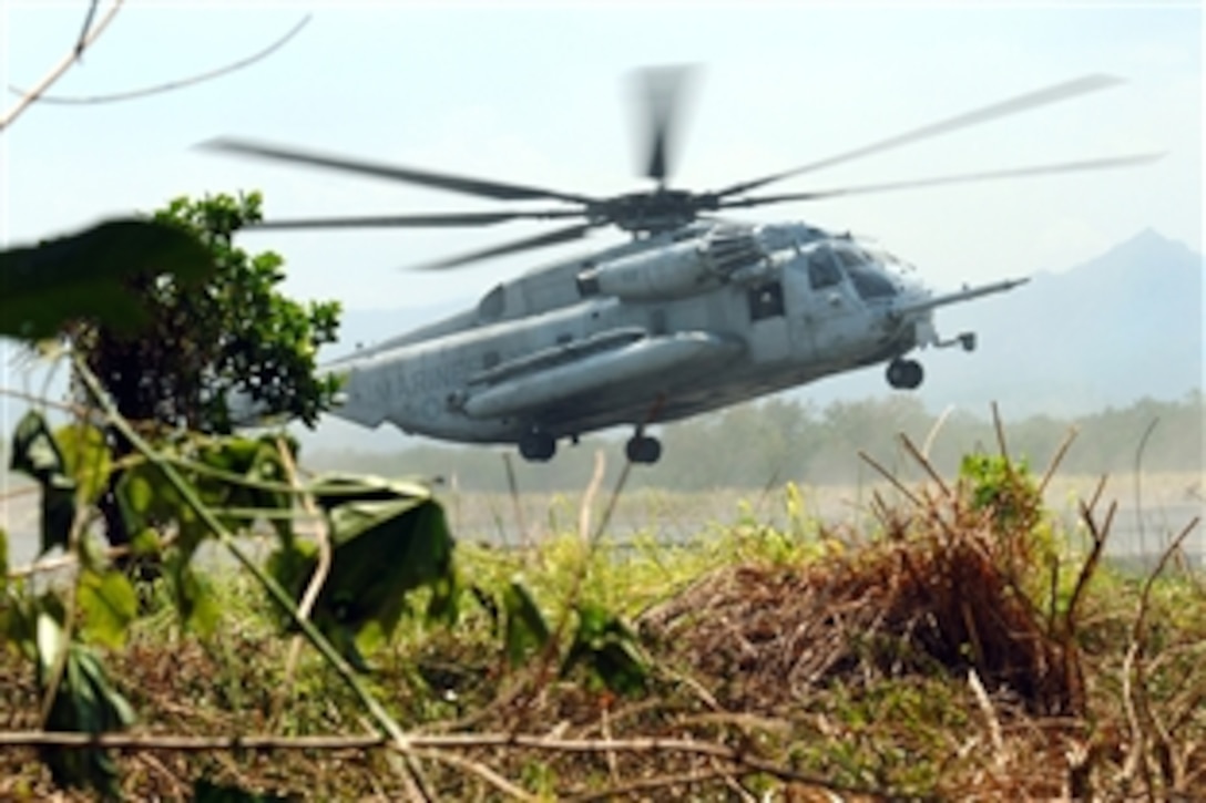 U.S. and Philippine marine forces conduct an air raid exercise during Balikatan 2009, Basa Air Base, Philippines, April 14, 2009. Balikatan 2009 is an annual combined, joint-bilateral exercise involving U.S. military and armed forces of the Philippines personnel as well as subject matter experts from Philippine Civil Defense agencies.