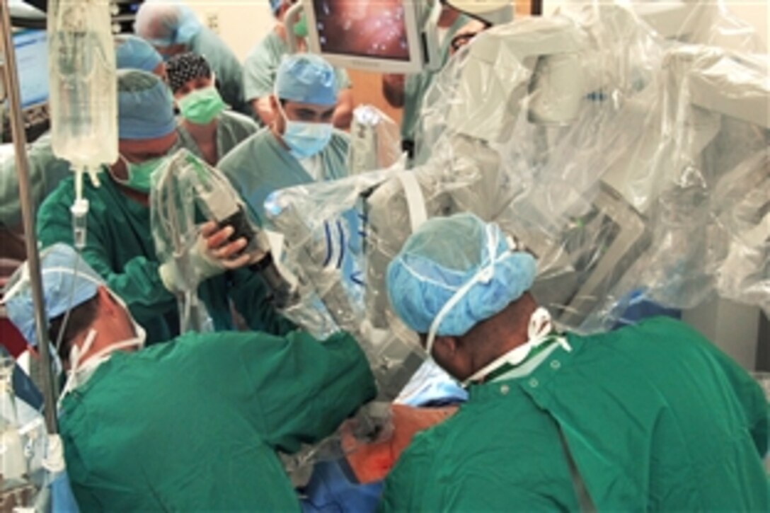 A robot is placed by doctors for a laparoscopic prostatectomy to remove prostate cancer at Wilford Hall Medical Center on Lackland Air Force Base, Texas, April 10, 2009. This was the first robot-assisted surgery in the Air Force and was performed by Lt. Col. (Dr.) Kyle Weld, director of endourology at the 59th Surgical Specialties Squadron.