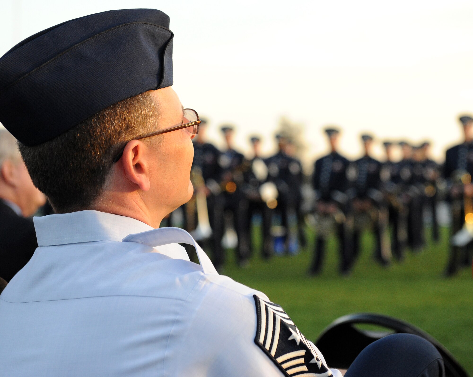 LANGLEY AIR FORCE BASE, Va. -- Chief Master Sgt. Kevin Slater, 1st Fighter Wing command chief, enjoys the Air Force Heritage Band performance at the opening ceremony of the Hampton Roads Air Force Week April 18.  The ceremony kicked off a week of activities that will allow the community an opportunity to meet Air Force members, see how they help protect America, and allow them to say "thank you" for their support. (U.S. Air Force photo/Airman 1st Class Gul Crockett)
