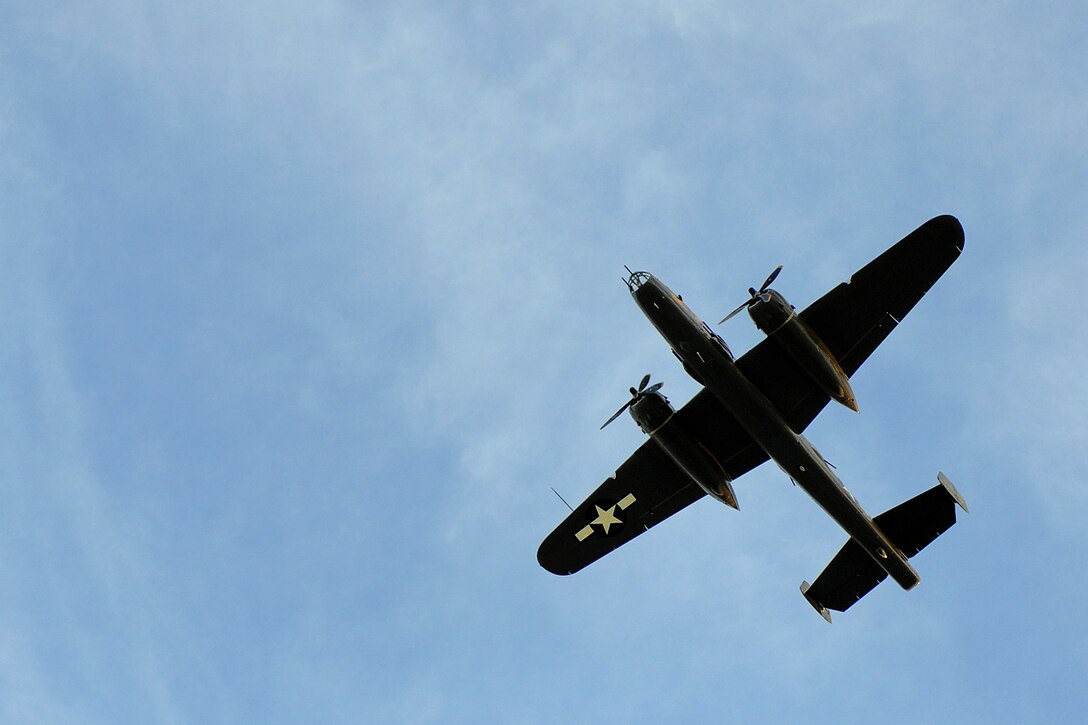LANGLEY AIR FORCE BASE, Va. -- A B-25 Bomber flies over Hampton University's Armstrong Stadium during the opening ceremony of Air Force Week April 18. The ceremony kicked off a week of activities that will allow the community an opportunity to meet Air Force members, see how they help protect America, and allow them to say "thank you" for their support. (U.S. Air Force photo/Airman 1st Class Gul Crockett)