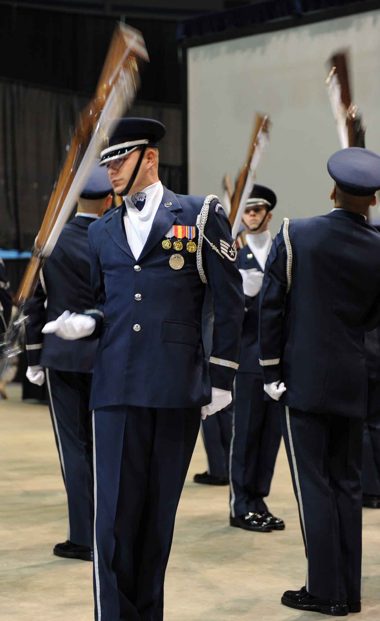 LANGELY AIR FORCE BASE, Va. -- Members of the Air Force Honor Guard perform during the opening ceremony of Air Force Week at Hampton University April 18. The ceremony kicked off a week of activities that will allow the community an opportunity to meet Air Force members, see how they help protect America, and allow them to say "thank you" for their support. (U.S. Air Force photo/Airman 1st Class Zachary Wolf) 