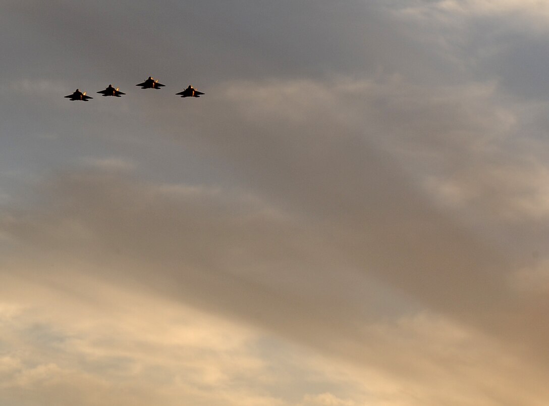 LANGELY AIR FORCE BASE, Va. -- Four F-22A Raptors fly over Hampton University's Armstrong Stadium during the opening ceremony of Air Force Week April 18.  The ceremony kicked off a week of activities that will allow the community an opportunity to meet Air Force members, see how they help protect America, and allow them to say "thank you" for their support. (U.S. Air Force photo/Airman 1st Class Zachary Wolf) 
