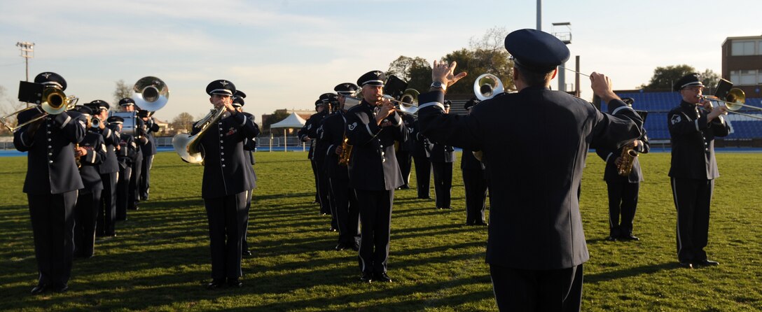 LANGLEY AIR FORCE BASE, Va. -- Lt. Col. Doug Monroe, Air Force Heritage Band commander, conducts the band during the opening ceremony of Air Force Week at Hampton University April 18.  The ceremony kicked off a week of activities that will allow the community an opportunity to meet Air Force members, see how they help protect America, and allow them to say "thank you" for their support. (U.S. Air Force photo/Airman 1st Class Zachary Wolf) 