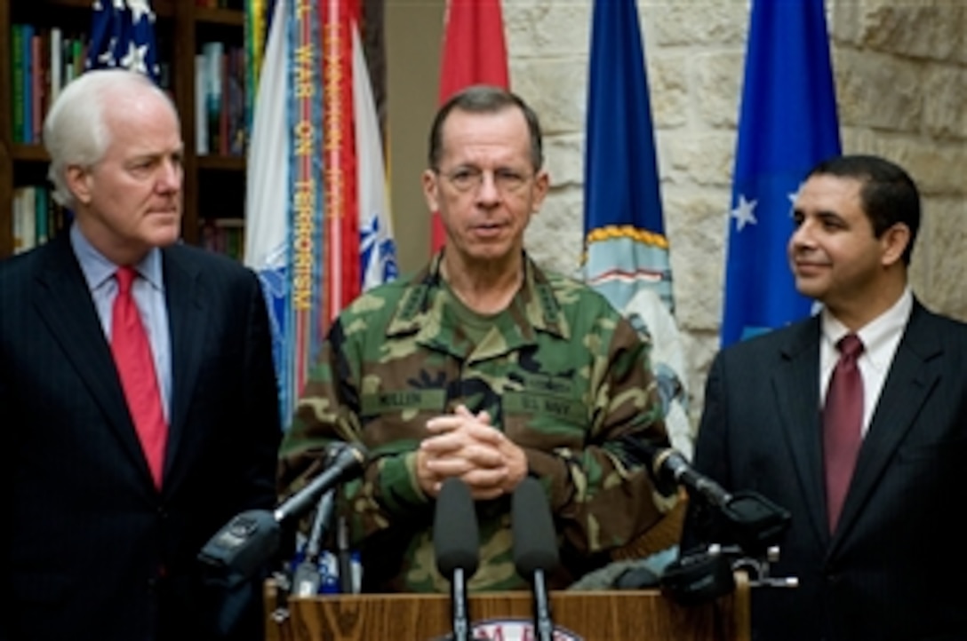 U.S. Navy Adm. Mike Mullen, chairman of the Joint Chiefs of Staff, conducts a news conference with U.S. Rep. Henry Cuellar, right, and U.S. Sen. John Cornyn, both of Texas, after a visit to the Warrior and Family Support Center at Brooke Army Medical Center in San Antonio, April 17, 2009. Mullen is on a four-day tour of the Lone Star State to visit installations and servicemembers. 