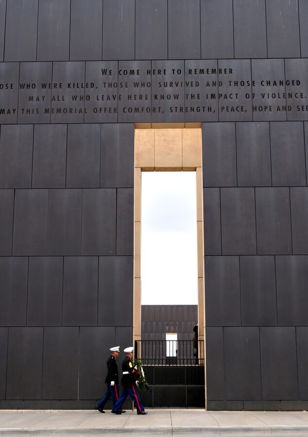 OKLAHOMA CITY - Maj. William Chronister, commanding officer Recruiting Station Oklahoma City and Sgt. Maj. Bryan K. Zickefoose, sergeant major RS OKC, walk in front of the Oklahoma City National Memorial on their way to present a wreath in memory of their fallen brother in arms Capt. Randolph Guzman and Sgt. Benjamin Davis. The fallen Marines were killed in the Oklahoma City Federal Building bombing April 19, 1995. "It is the duty of every Marine, not to forget our fallen and more importantly, always remember their sacrifice," said Chronister.
