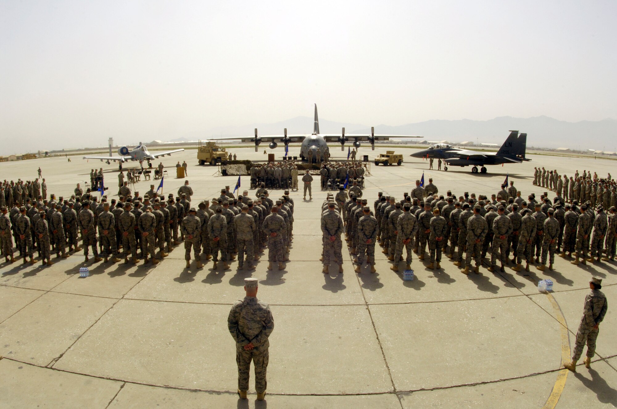 Airmen of the 455th Air Expeditionary Wing stood in formation for the wing change of command ceremony at Bagram Air Field, Afghanistan, April 18. The Airmen observed the time honored tradition as the wing leadership changed from Brig. Gen. Mike Holmes to the new commander Col. Steven Kwast. (U.S. Air Force photo/Senior Airman Steven Doty)(Released)