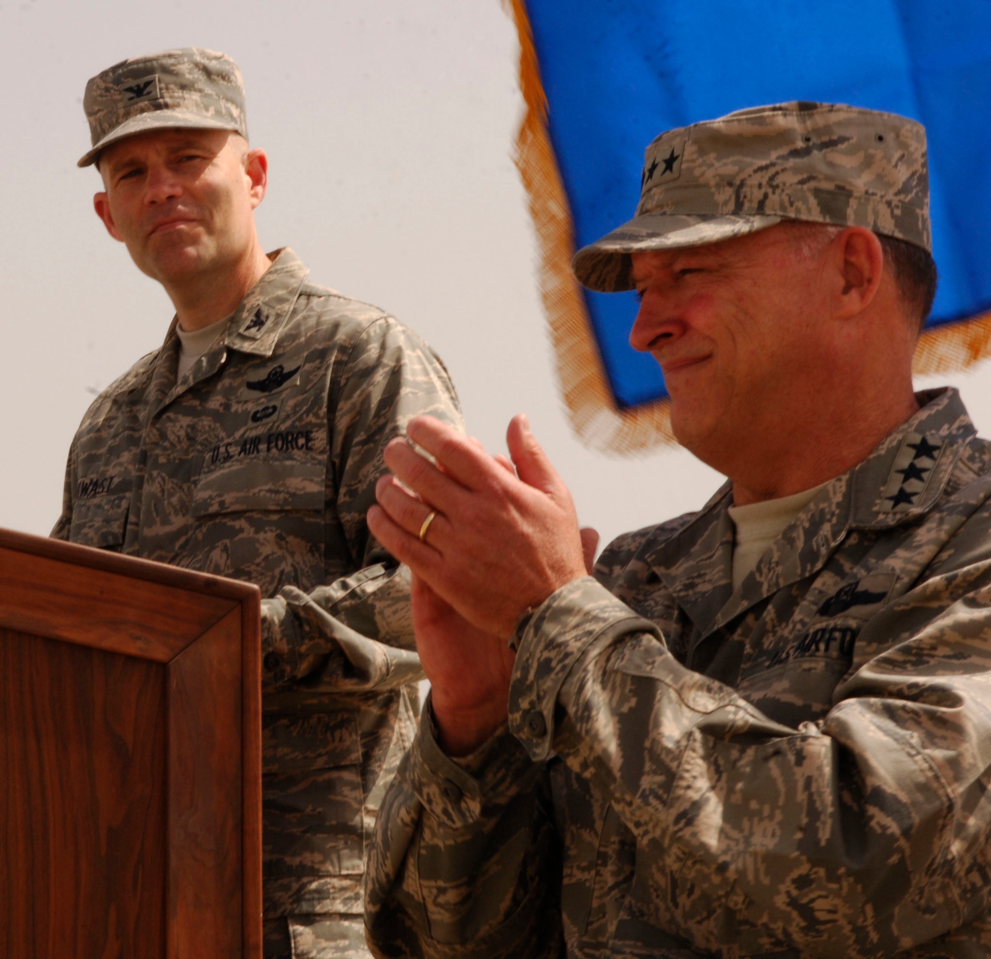 Col. Steven Kwast, 455th Air Expeditionary Wing Commander, addresses his newly assigned command as Lt. Gen. Gary L. North, 9th Air Force and U.S. Air Forces Central commander, applauds during the Change of Command ceremony at Bagram Air Field, Afghanistan, April 18. Colonel Kwast was last assigned as Deputy Director of Requirements, Headquarters Air Combat Command, Langley AFB, Va. (U.S. Air Force photo/Senior Airman Erik Cardenas)(Released)