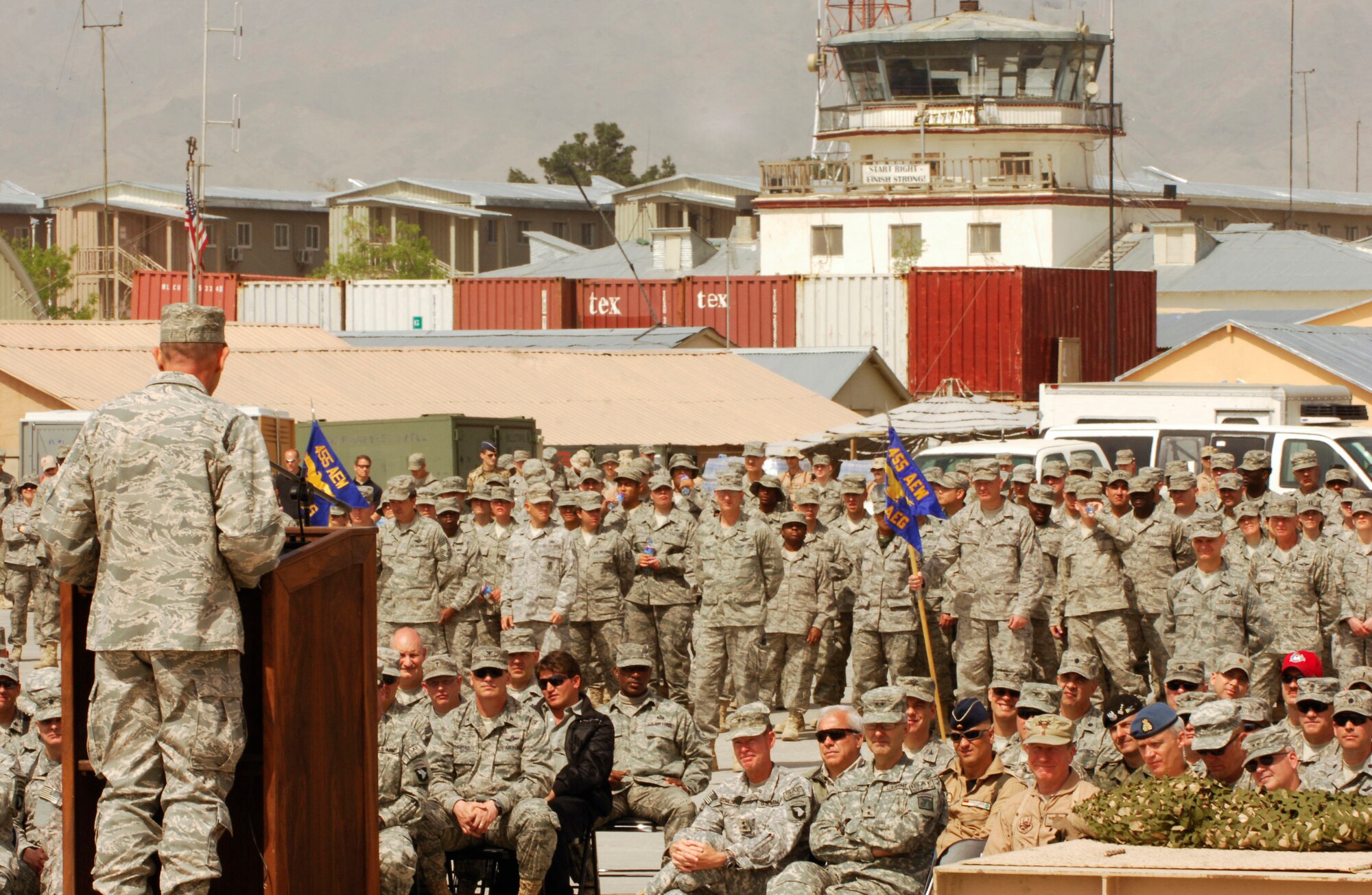 Brig. Gen. Mike Holmes delivers his final speech as wing commander to U.S. and Coalition service members during the Change of Command ceremony at Bagram Air Field, Afghanistan, April 18. ?I?ve been honored by the opportunity to serve along the best people,? General Holmes said. ?You all found ways to say yes instead of reasons to say no. We?ve made the wing better with every Air Expeditionary Force cycle.? General Holmes is relocating to the Washington D.C. area for reassignment. (U.S. Air Force photo/Senior Airman Erik Cardenas)(Released)