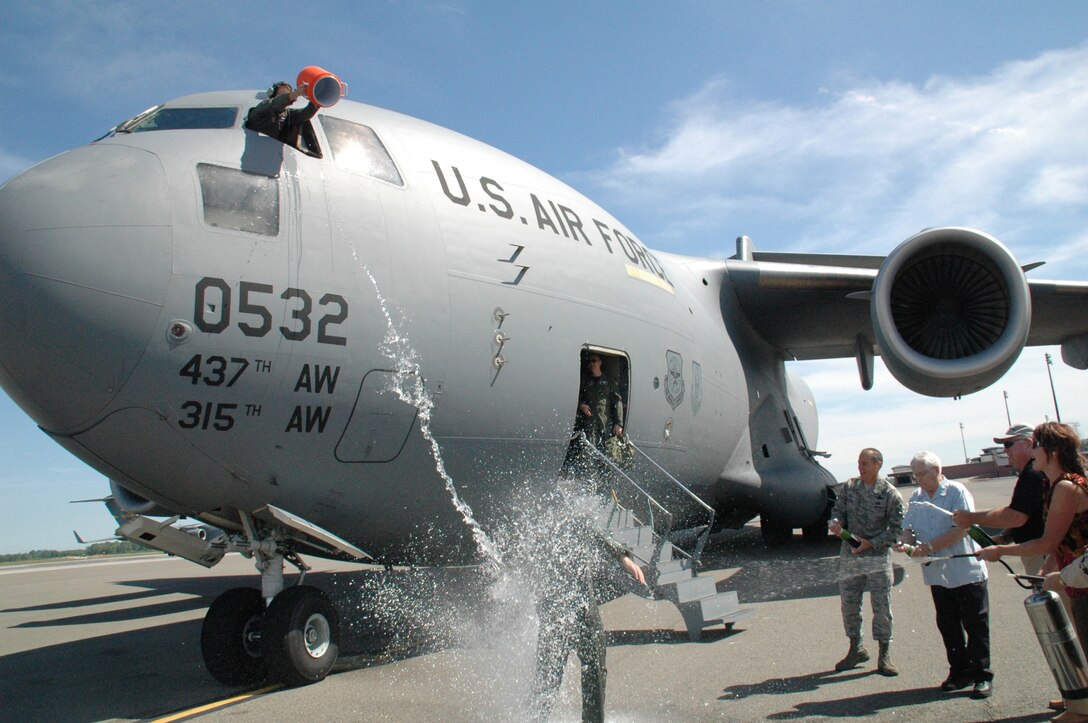 Col. Tim Wrighton, commander of the 315th Airlift Wing at Charleston Air Force Base, gets doused with water following his "Fini Flight" April 18. Col. Wrighton is scheduled to relinquish command of the 315th Airlift Wing in an official ceremony at Charleston Air Force Base April 19. 