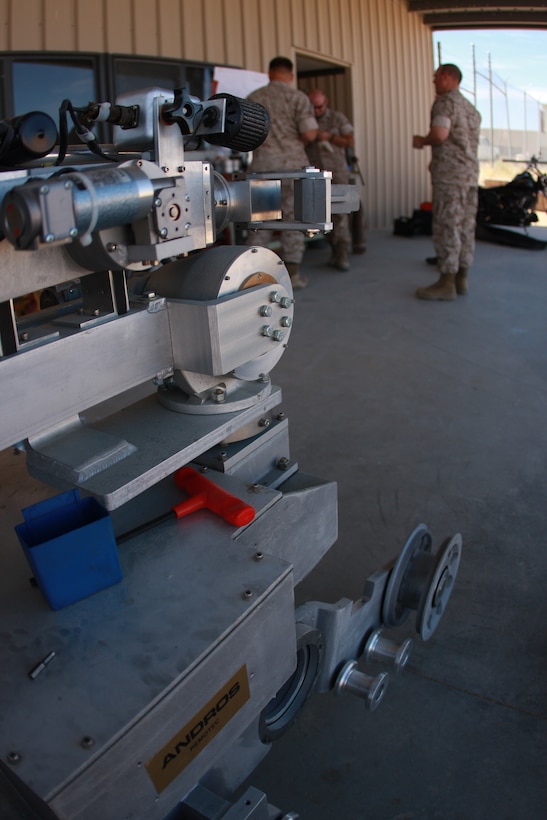 Remotec’s Remote Ordinance Neutralization System robot stands as Explosive Ordinance Disposal technicians from Marine Wing Support Squadron 374 perform maintenance on the chassis of the robot April 21.