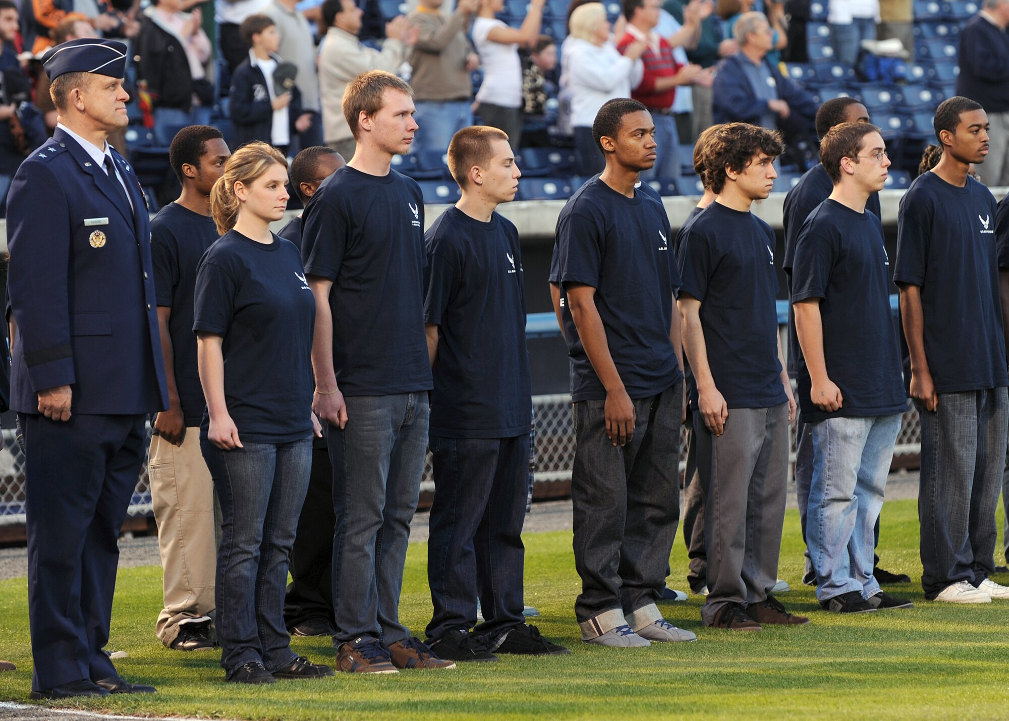 LANGLEY AIR FORCE BASE, Va. -- Maj. Gen. Frank Gorenc, Air Combat Command Air and Space Operations Directorate, stands with 45 Air Force Delayed Entry Program participants from the Hampton Roads area at the Norfolk Tides baseball season opener April 20 during Air Force Week. AF Week is the Air Force's chance to thank those who support the military through a variety of events.  (U.S. Air Force photo / Airman 1st Class Jonathan Koob)   