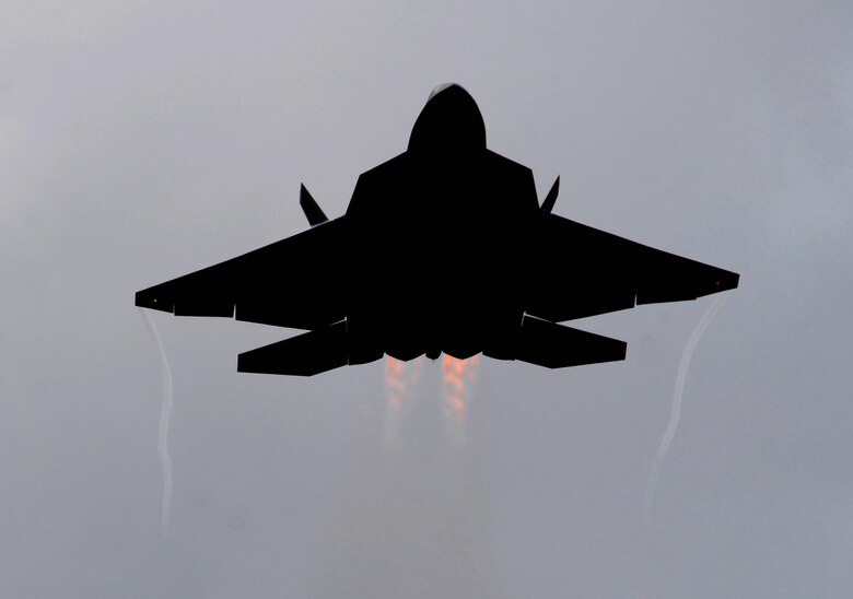 An F-22 Raptor from the 90th Fighter Squadron Elmendorf Air Force Base, Alaska gets airborne over Andersen Air Force Base, Guam. The 90th FS from Elmendorf Air Force Base, Alaska just completed a 3-month deployment to Andersen as part of a theater security package. As part of the continuing force posture adjustments to address worldwide requirements, the United States continues to deploy additional forces like the F-22 throughout the Western Pacific.(U.S. Air Force photo/ Master Sgt. Kevin J. Gruenwald) released      