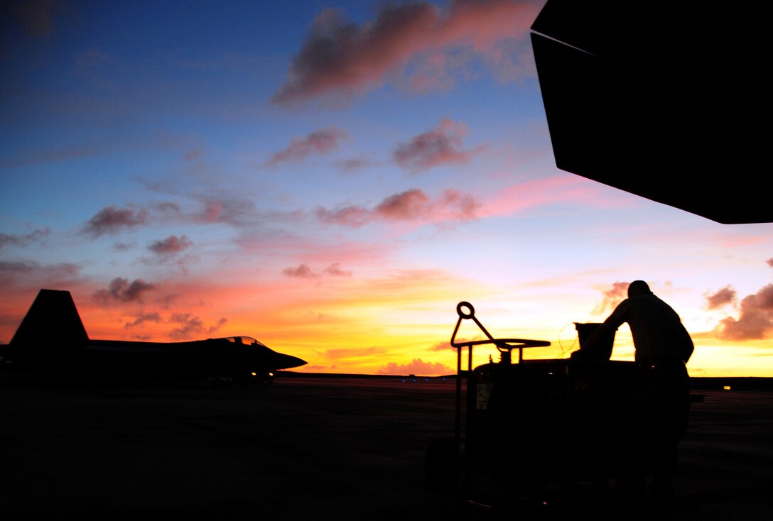 A 36th Expeditionary Aircraft Maintenance crew chief performs  an inspection on an F-22 Raptor the night before it departs Andersen Air Force Base, Guam, April 15. The 90th Expeditionary Fighter Squadrons  90-day deployment to Andersen Air Force Base, Guam, consisiting of more than 250 Airmen and 14 aircraft, came to a close April 16.  the 90th EFS was deployed here via a regularly scheduled Air Expeditionary Force rotation, demonstrating U.S. commitment to peace and stability throughout the Pacific region.(U.S. Air Force photo/Senior Airman Ryan Whitney)