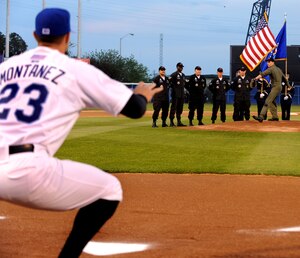 LANGLEY AIR FORCE BASE, Va. -- Maj. Dave Skalicky, F-22 Raptor Aerial Demonstration Team pilot, throws the first pitch of the Norfolk Tides baseball season opener April 20 during Air Force Week.  AF Week is the Air Force's chance to thank those who support the military through a variety of events.  (U.S. Air Force photo/Senior Airman Scott Aldridge)