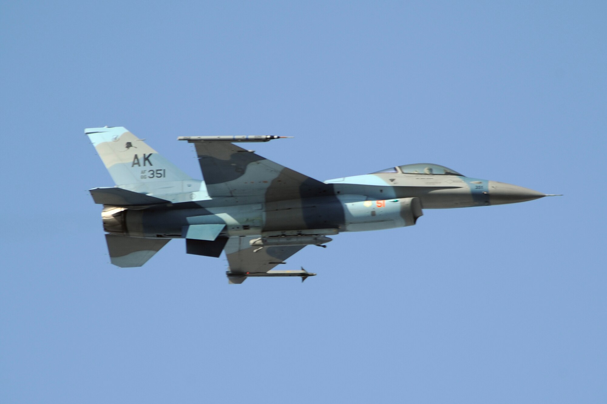 A F-16 Aggressor with the flanker scheme heads towards the Joint Pacific Alaskan Range Complex for a RED FLAG-Alaska training mission, April 20, 2009, Eielson Air Force Base, Alaska. RF-A 09-2 is a Pacific Air Forces command directed field training exercise which provides joint offensive counter-air, interdiction, close air support and large force employment training in a simulated combat environment. The aircraft is assigned to the 18th Aggressor Squadron.  (U.S. Air Force Photo/Senior Airman Jonathan Snyder)