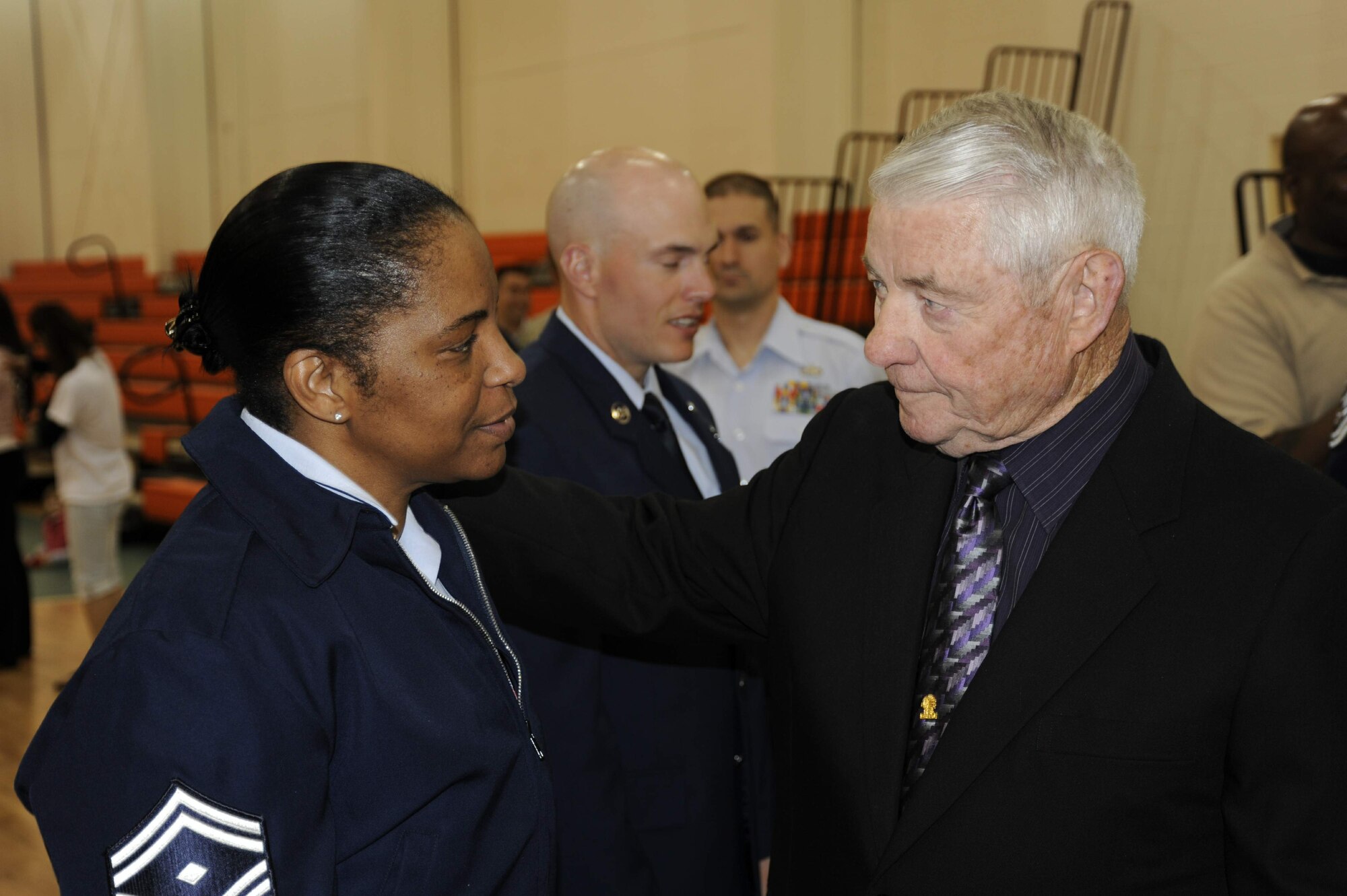 Retired Chief Master Sgt. of the Air Force Robert Gaylor, congratulates Senior Master Sgt. Shelina Fry for receiving a line number for chief master sergeant, after the "Honoring America's veterans" ceremony April 20.  The ceremony was part of Hampton Roads Air Force Week.  Sergeant Fry is the first sergeant for the 1st Equipment Maintenance Squadron at Langley Air Force Base, Va. (U.S. Air Force photo/Tech. Sgt. Matthew McGovern)