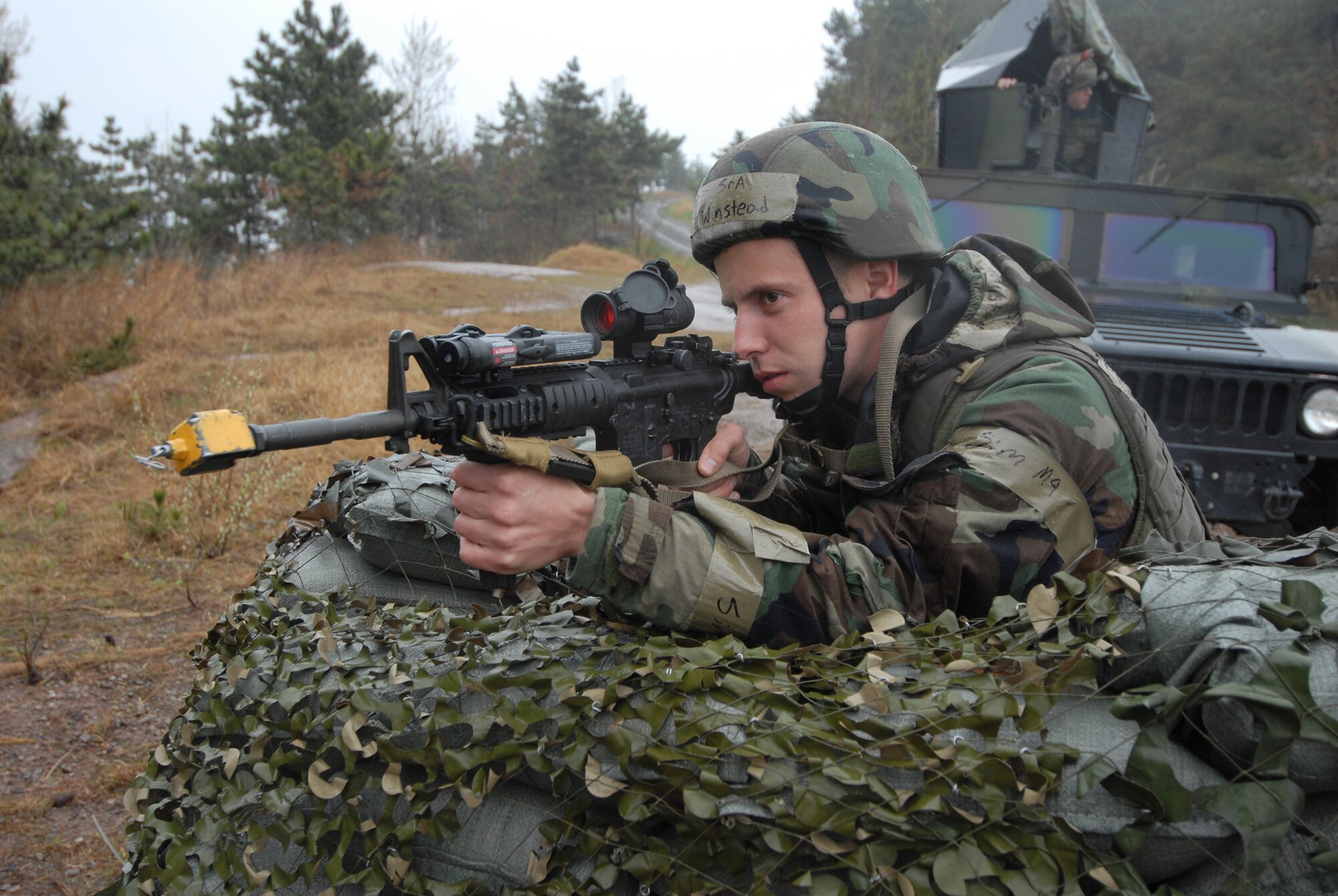 Senior Airman Justin Winstead, 8th Security Forces Squadron, mans a defensive fighting position during the Operational Readiness Inspection at Kunsan Air Base, Republic of Korea, April 20, 2009. Security forces defenders play a major role in completing the wing mission and will be evaulated alongside other Kunsan members by the more than 100 Pacific Air Forces Inspector General evaluators on station for the inpsection. (U.S. Air Force Photo/Senior Airman Gustavo Gonzalez)